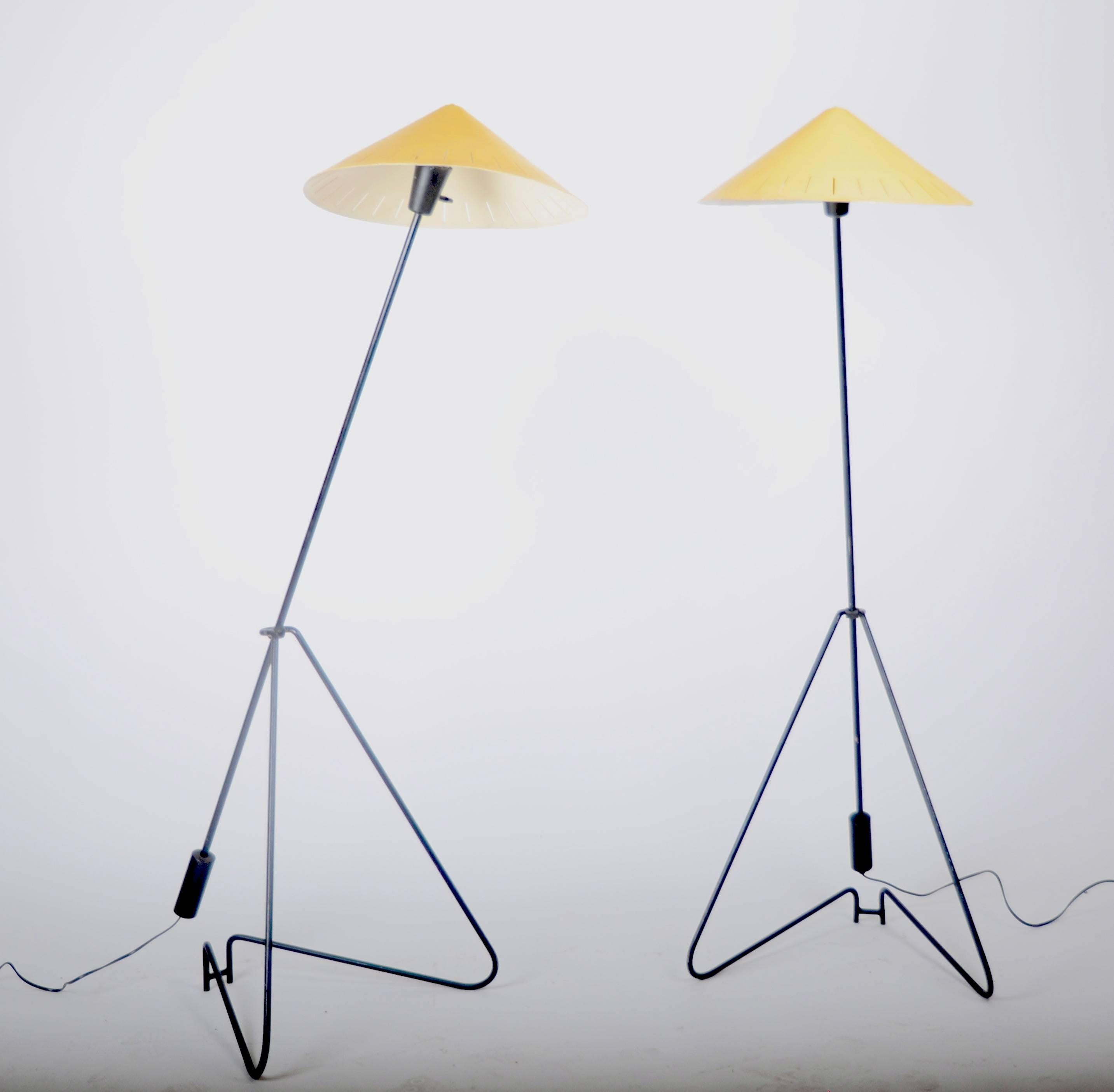 A pair of floor lamps in black and yellow lacquered metal, Sweden, 1950-1960s. Adjustable height.