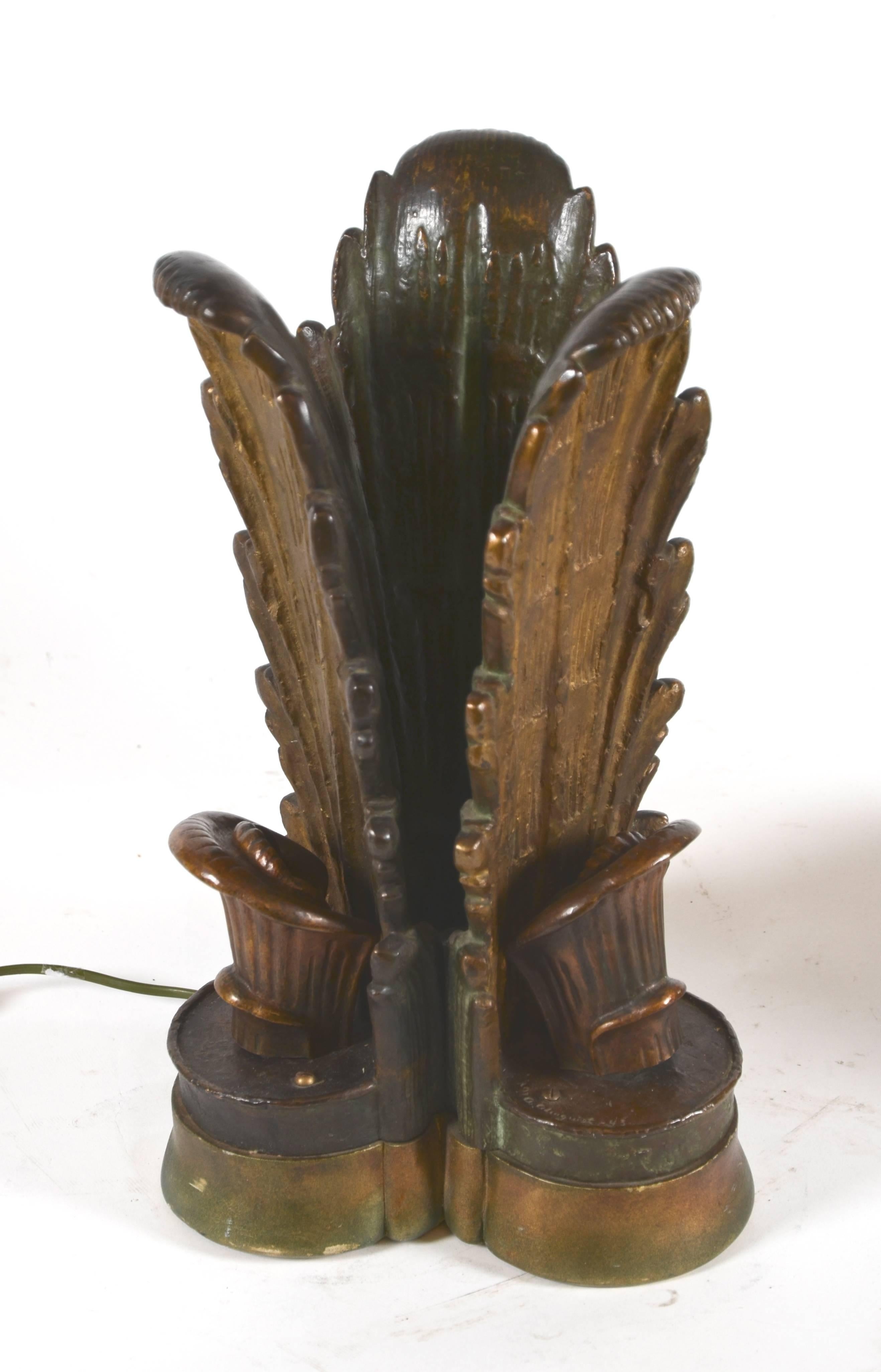 A pair of table lamps in bronze on a wooden base. Designed and signed by Ansgar Almquist, dated 1943. Swedish grace.

Height 42.5 cm.