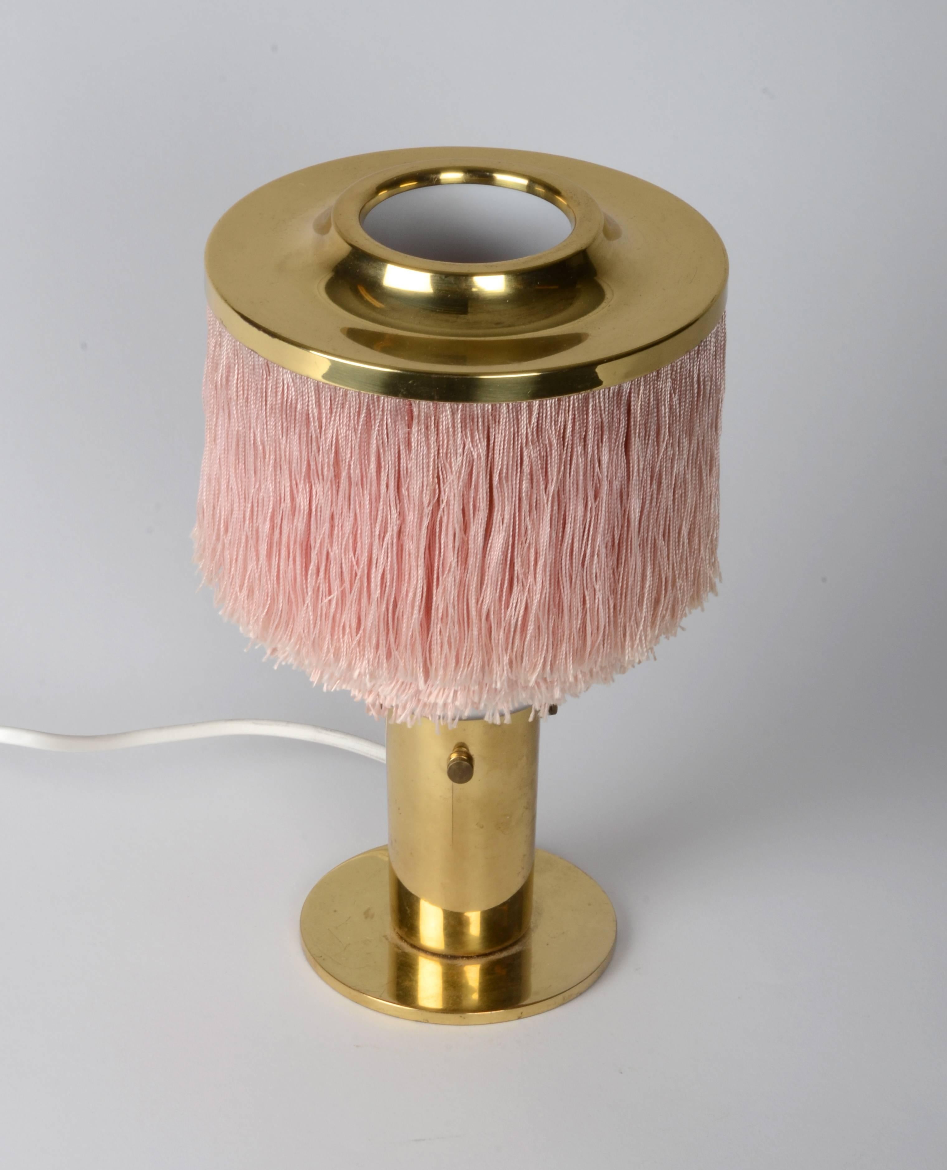 Table lamp in brass with silk fringe, designed by Hans-Agne Jakobsson for Markaryd, 1960s.

