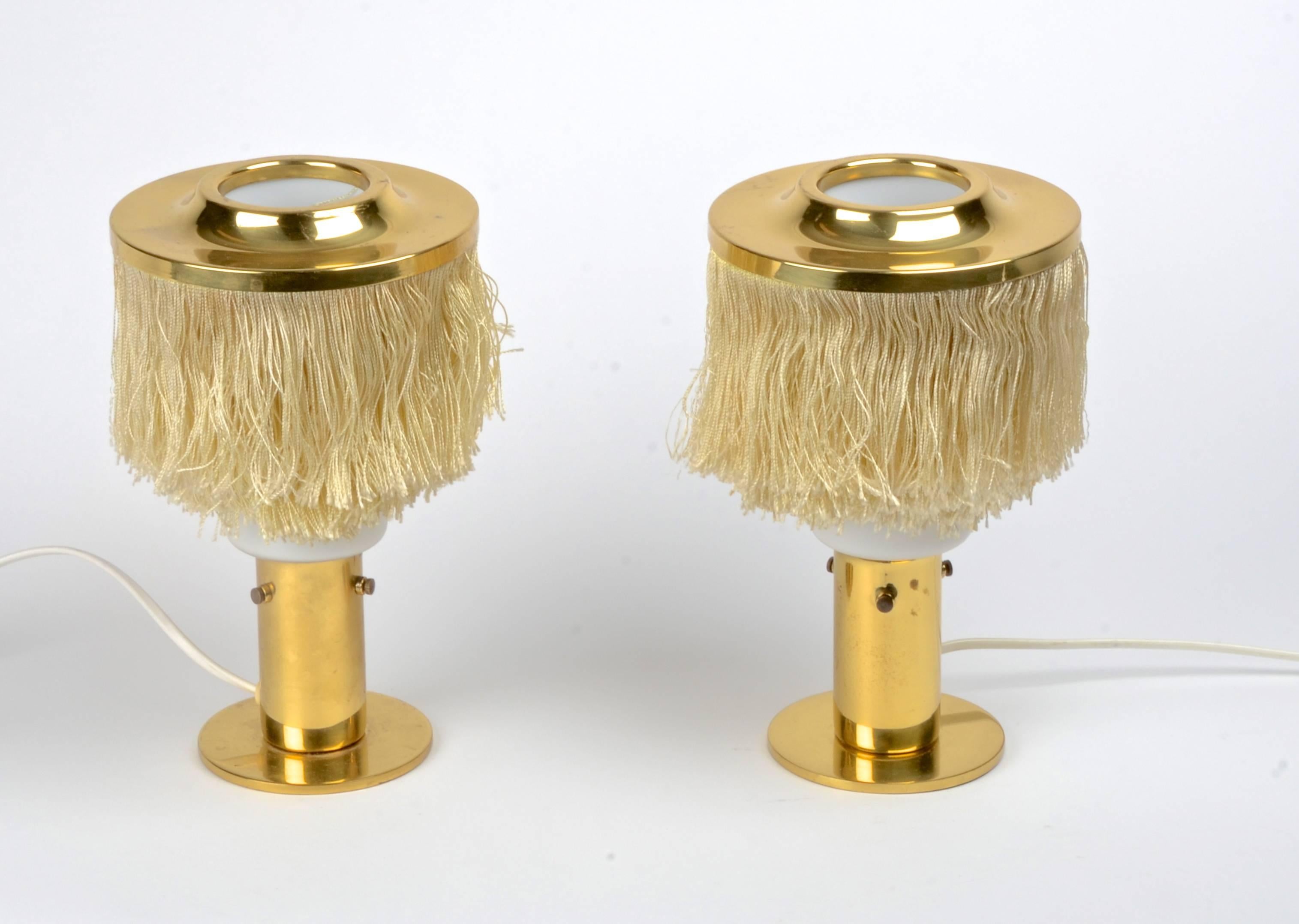 Table lamps in brass with silk fringe, designed by Hans-Agne Jakobsson for Markaryd, Sweden, 1960s.