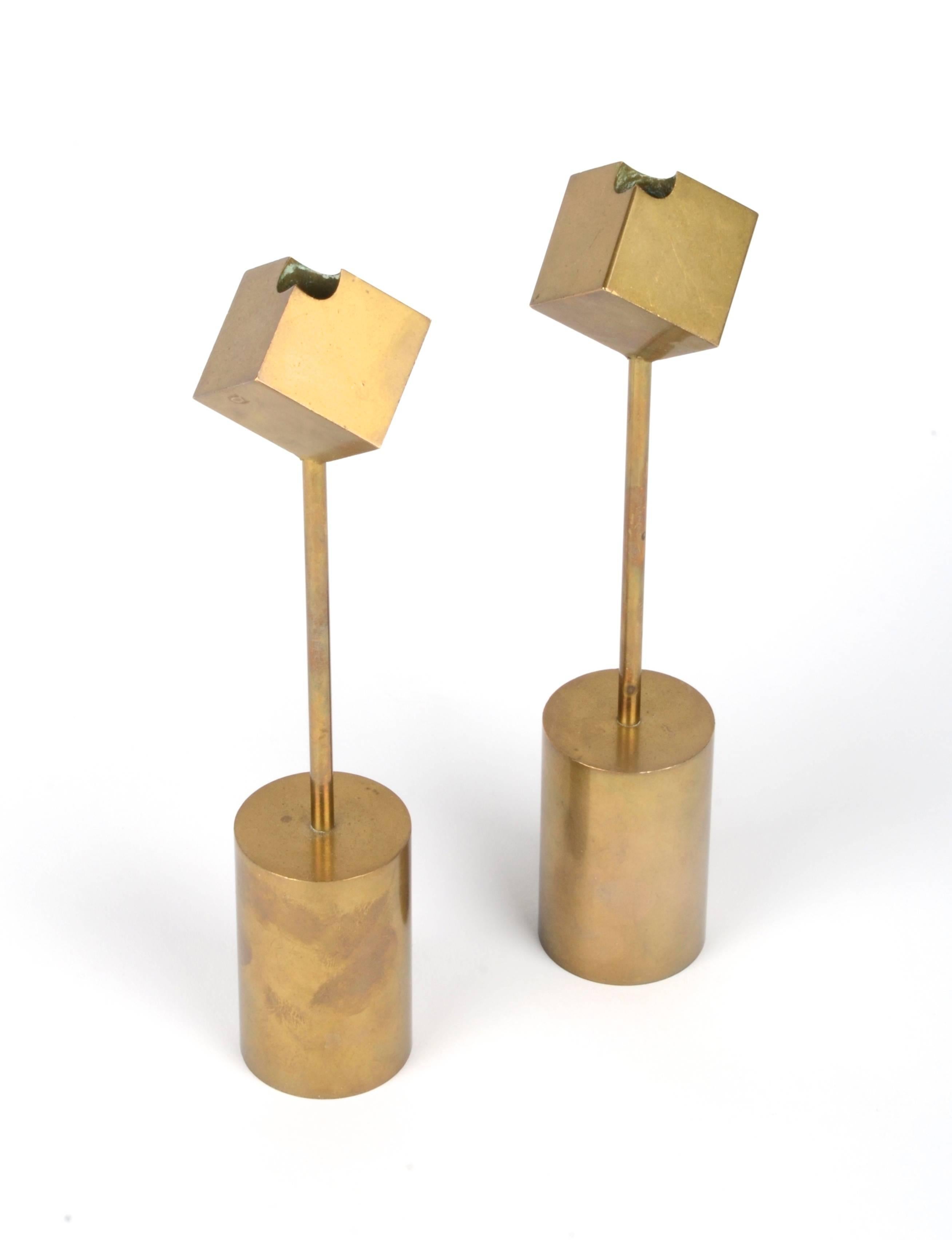 A pair of candleholders in brass, designed by Pierre Forssell for Skultuna 1607, Sweden, circa 1960s.