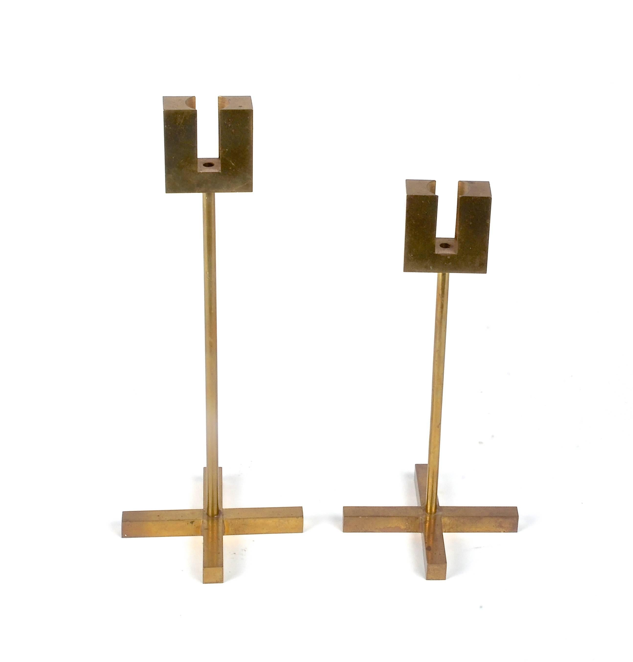 A pair of candlesticks in brass, designed by Pierre Forssell for Skultuna 1607, Sweden, mid-1900s.