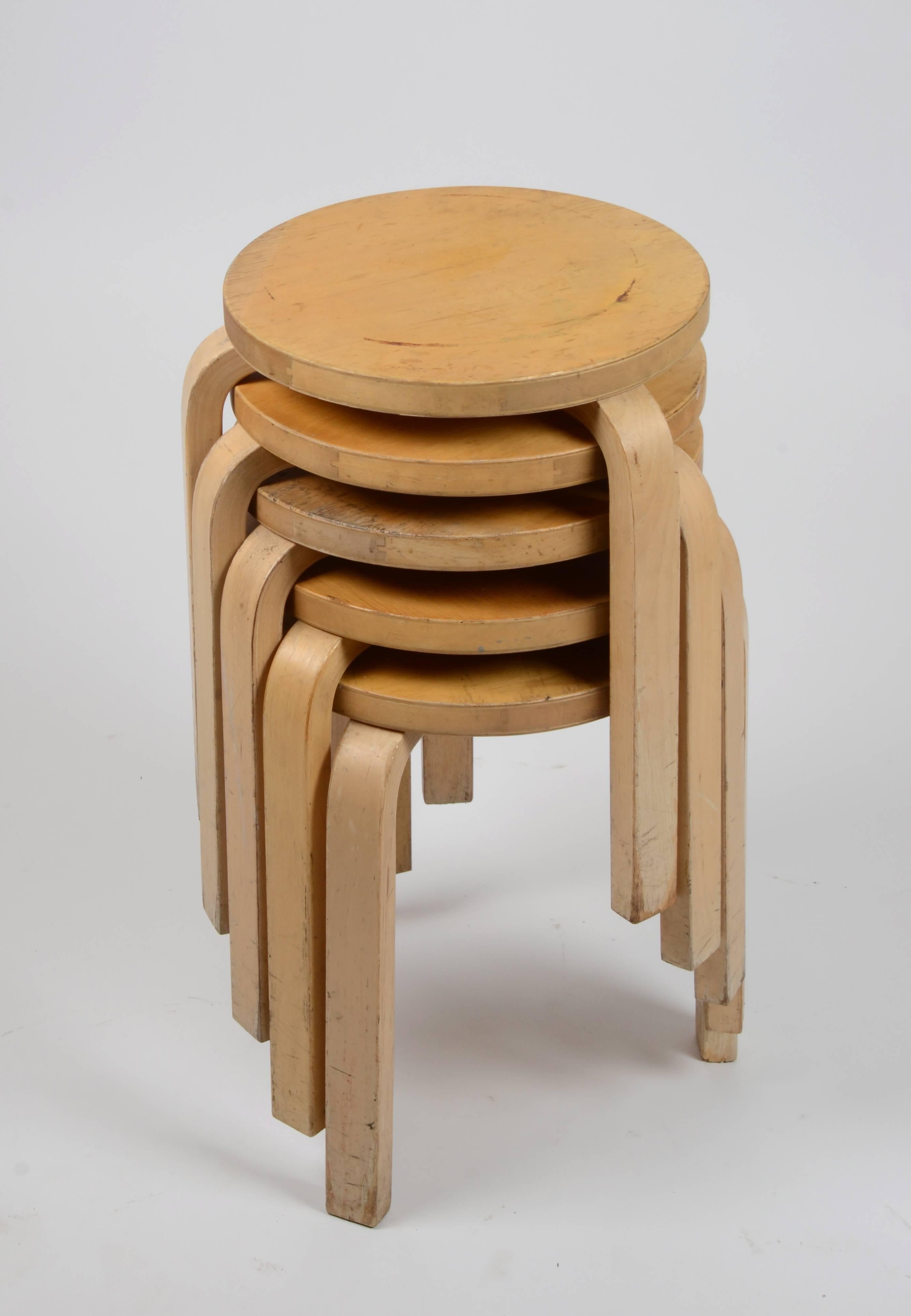 Five stacking chairs in beech, model 60 designed by Alvar Aalto in 1933.