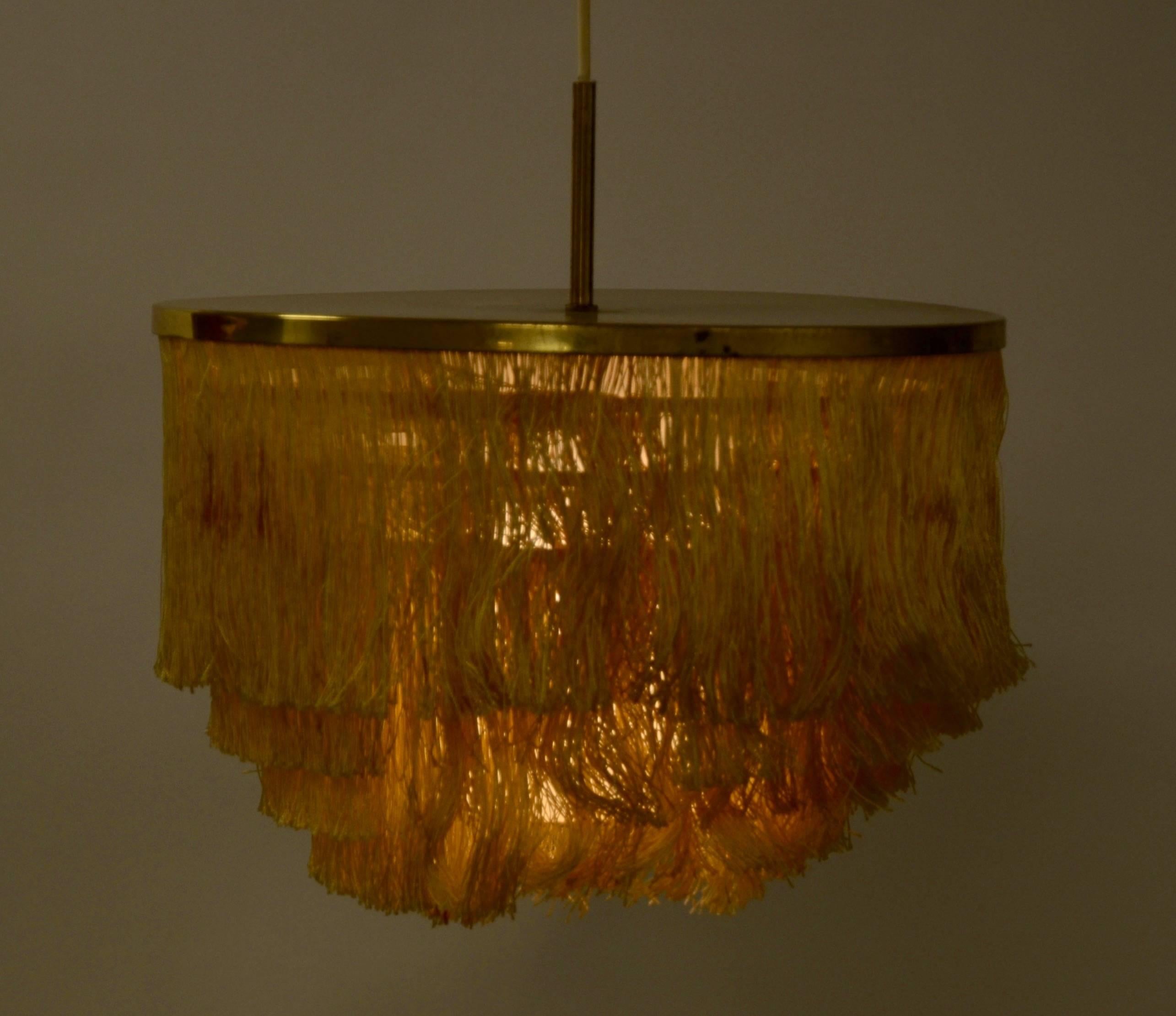 Brass pendant light with silk fringe. Designed by Hans-Agne Jakobsson for Markaryd Sweden, 1960s.
 