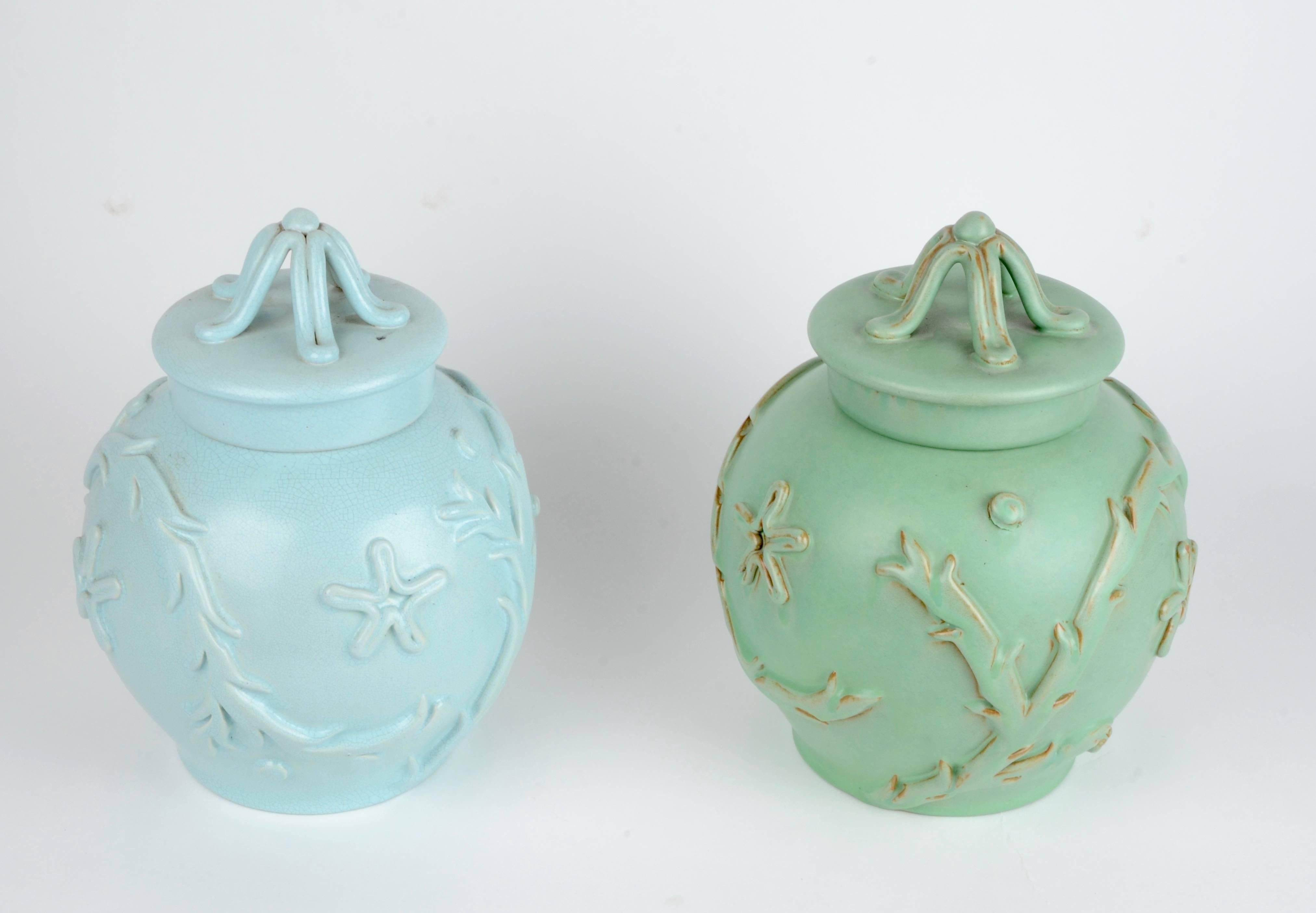 A pair of urns in faience, designed by Eva Jancke-Björk for Bo Fajans Gefle, mid-1900.