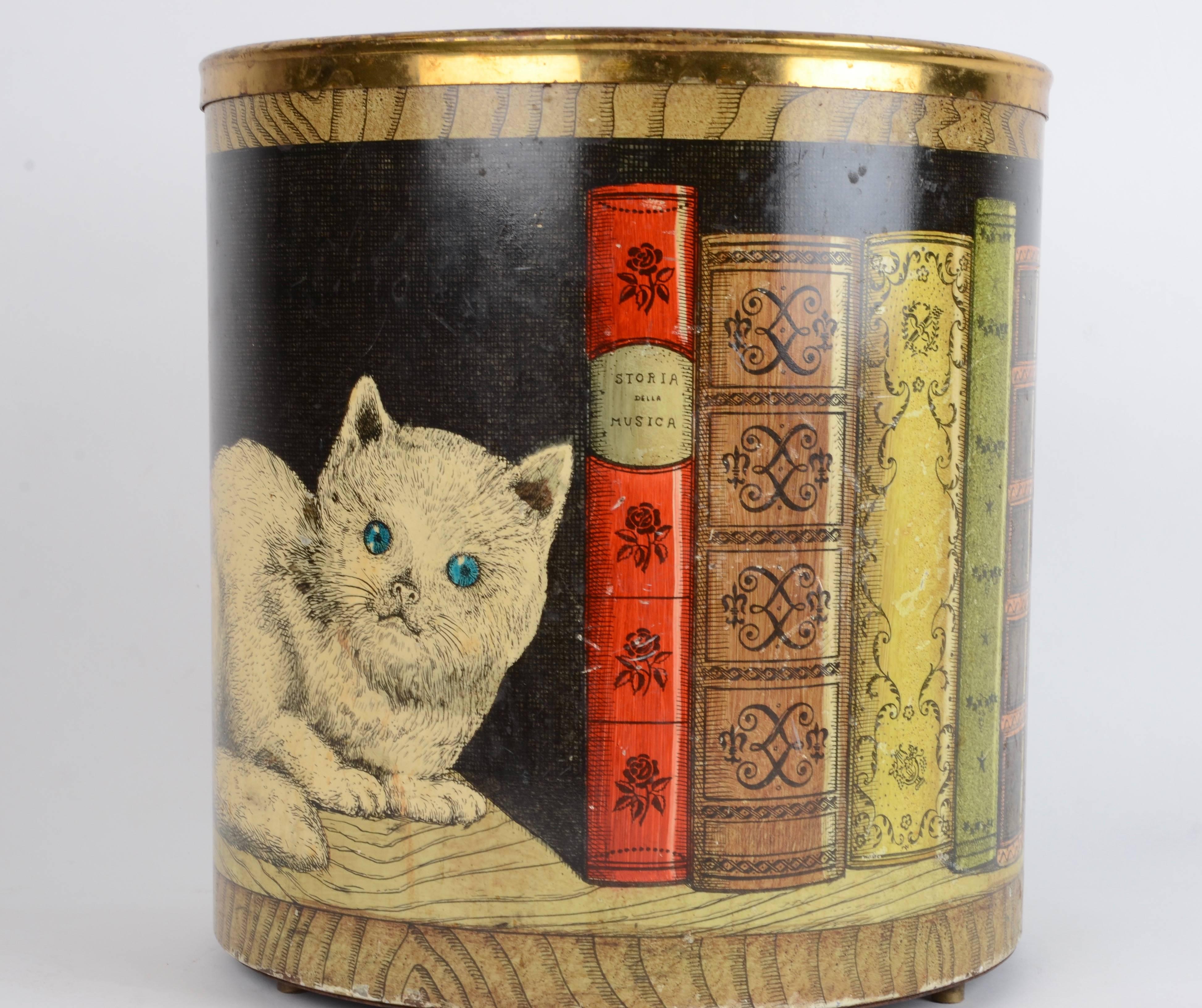 Waste paper bin with motif of cat and books, designed by Piero Fornasetti, mid-1900s.