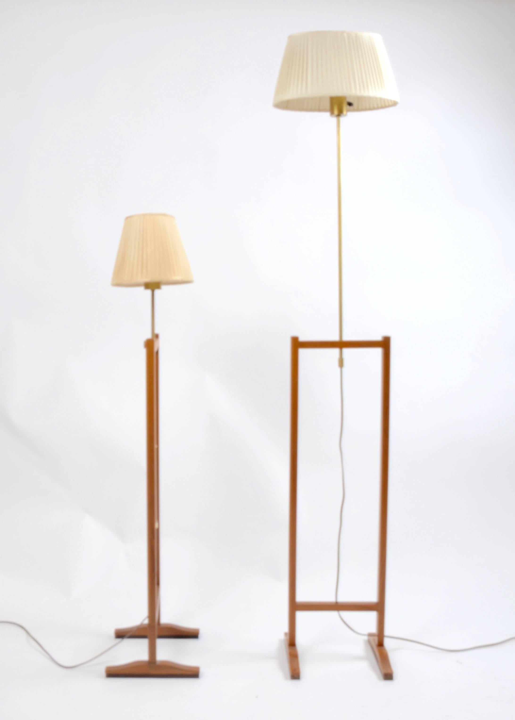 A pair of floor lamps in walnut and brass, model 2548. Designed by Josef Frank for Firma Svenskt Tenn, Sweden, 1952.