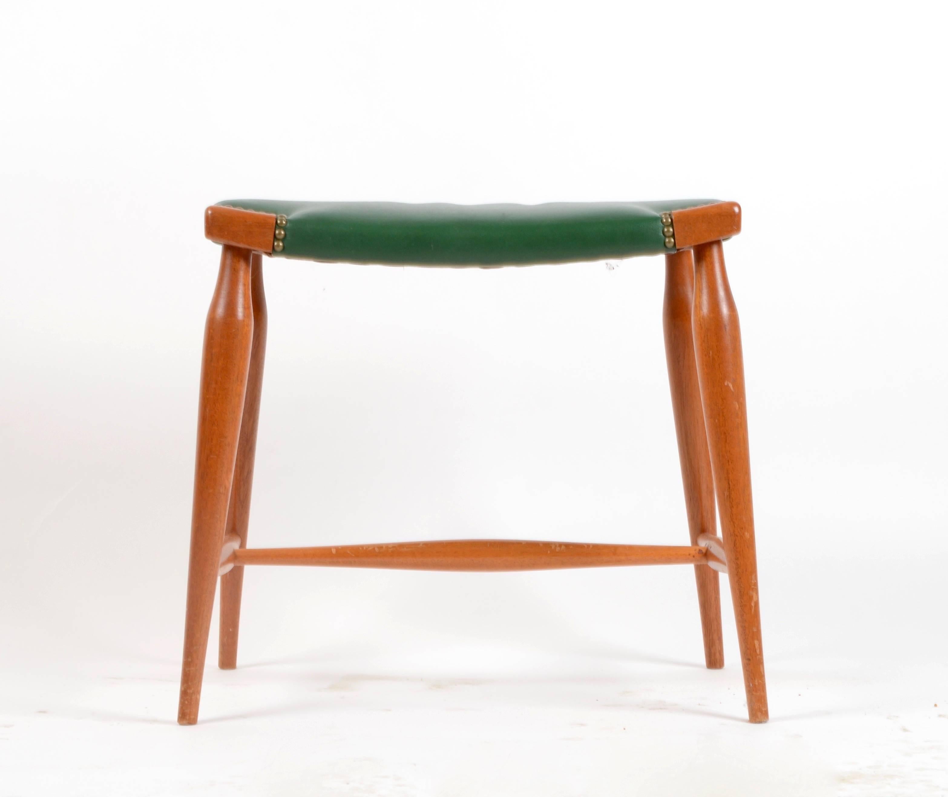 Stool in mahogany and leather designed by Josef Frank for Firma Svenskt Tenn, Sweden, mid-1900s.