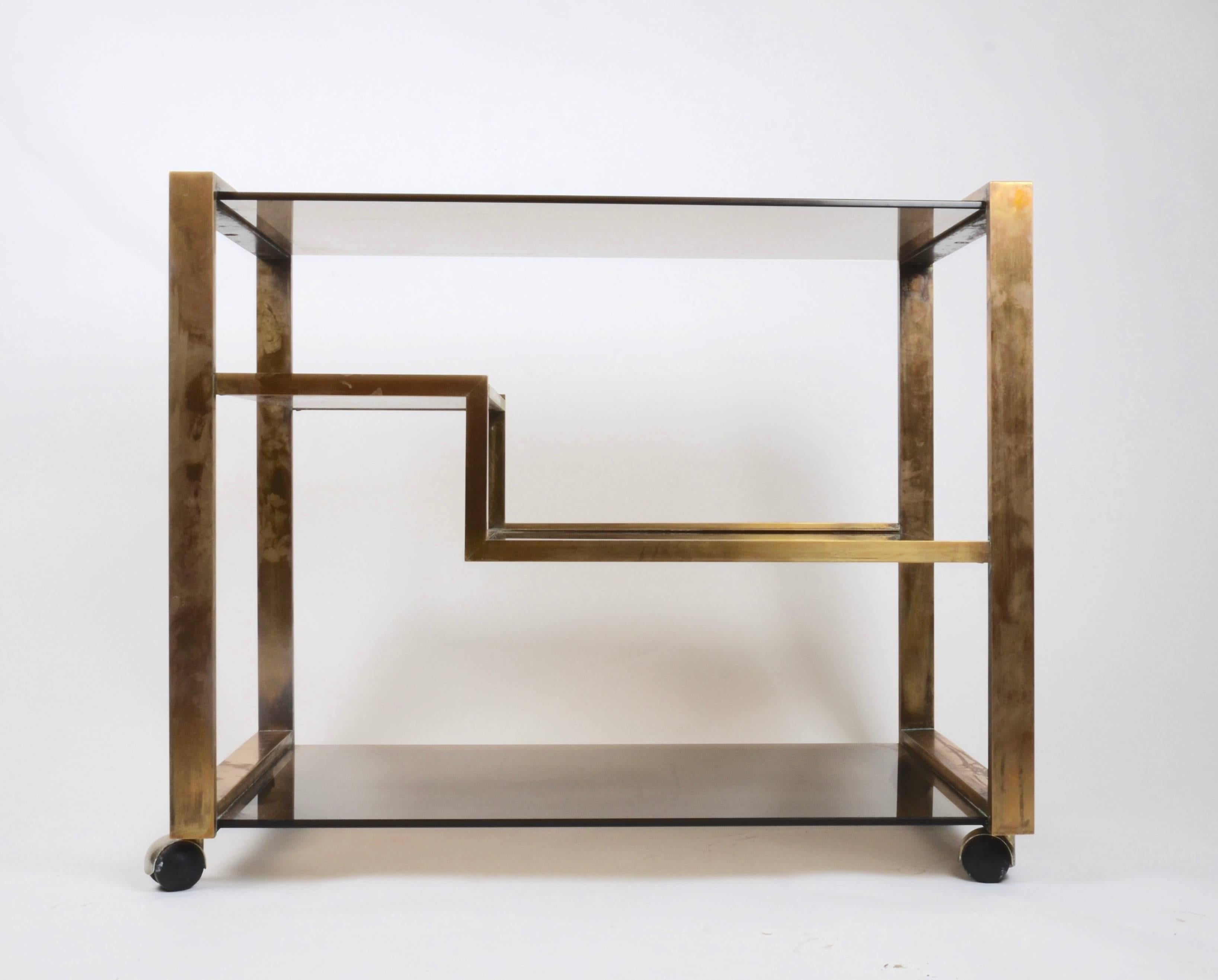 Italian bar cart in smoked glass and brass, Italy, 1970s.