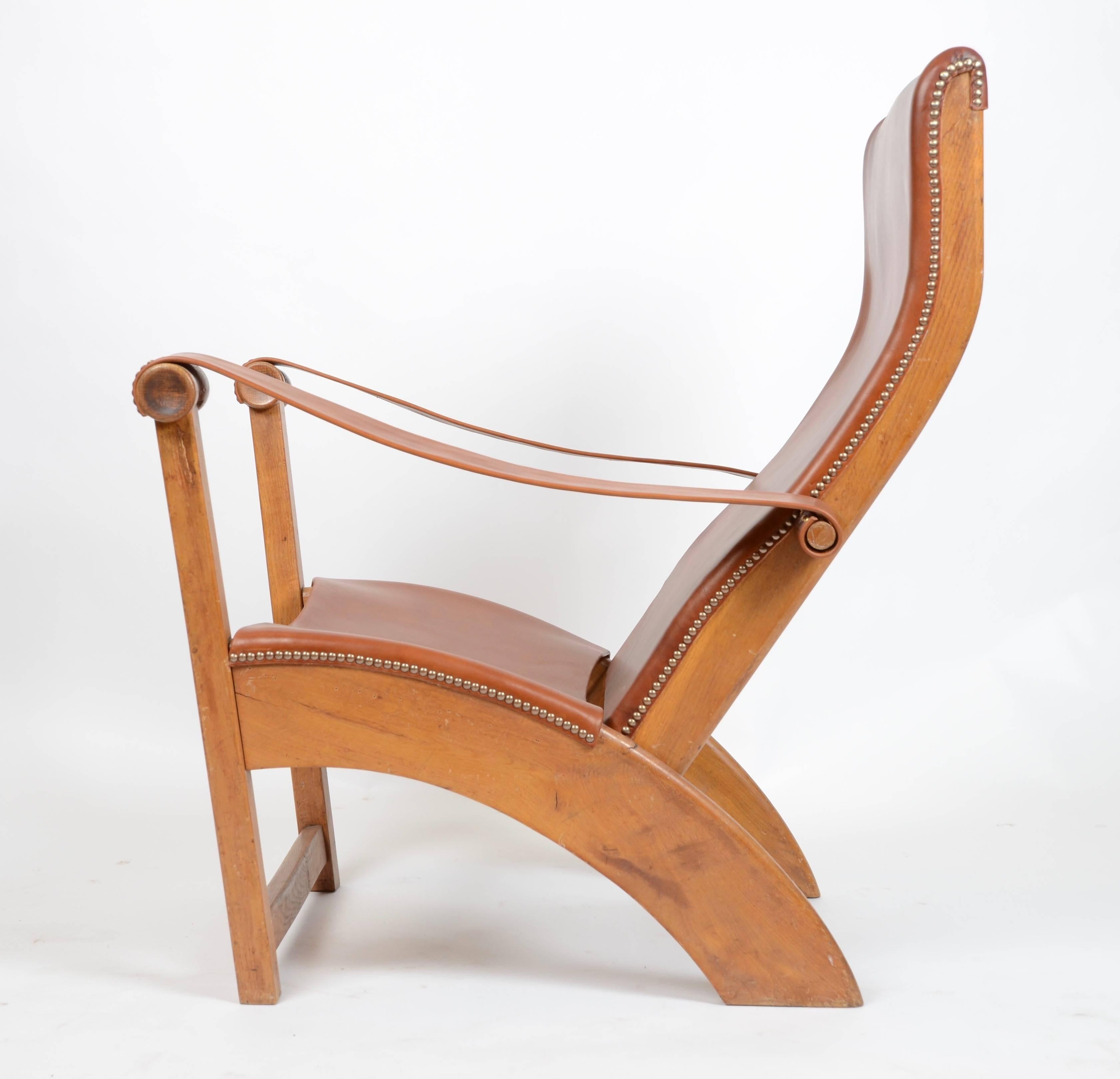 Easy chair, model Copenhagen / Københavnerstolen, designed by Mogens Voltelen, in 1936 for Niels Vodder. In patinated oak, leather, brass.