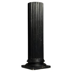 Neoclassical column in black plaster