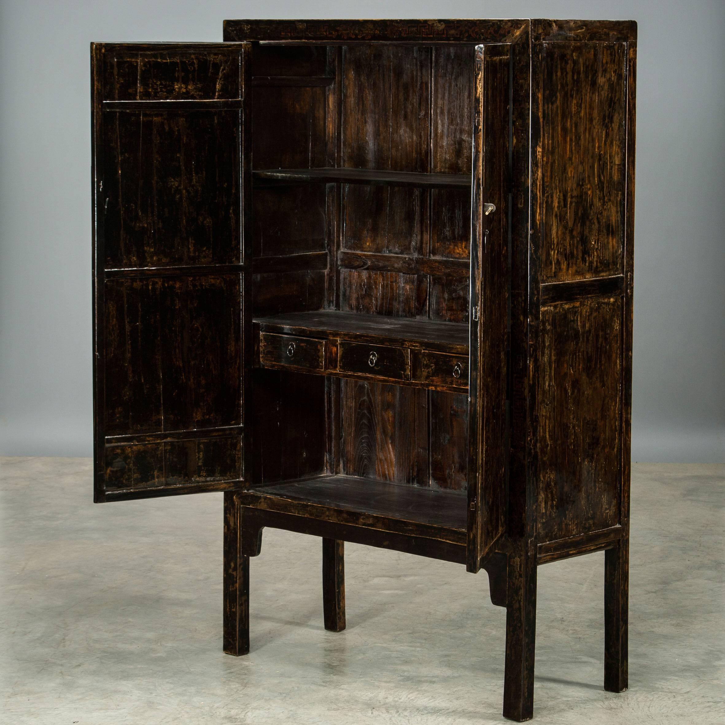Black lacquer cabinet with traces of decorations, which time has given a beautiful natural original patina. Shanxi circa 1800.

Finish: Clear Chinese lacquer polishing, which enhances the natural patina.
