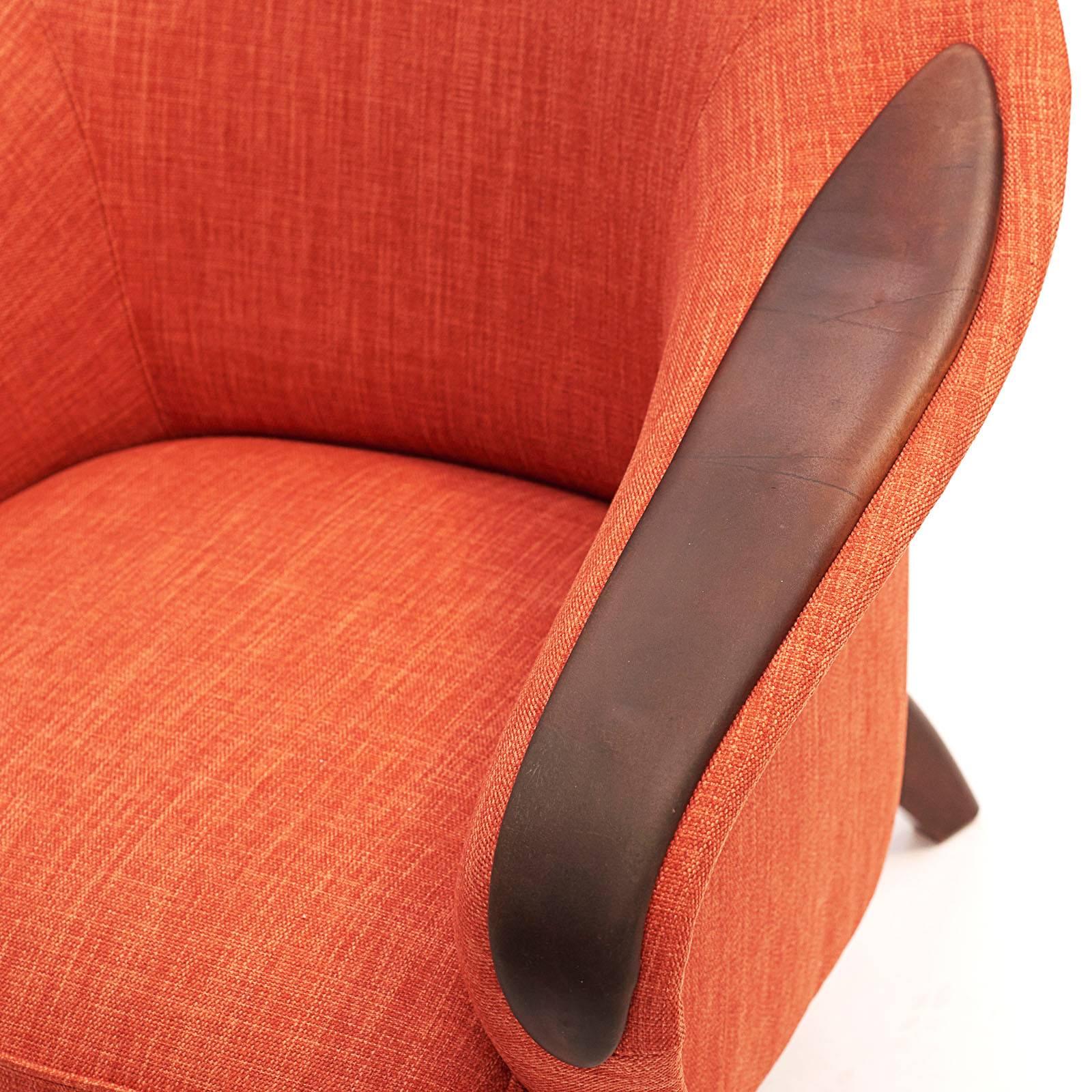 Danish upholstered and leather club chair, circa 1960, with a tub back and partially padded leather armrest.

Original leather with a warm patina and new upholstery from Baker.