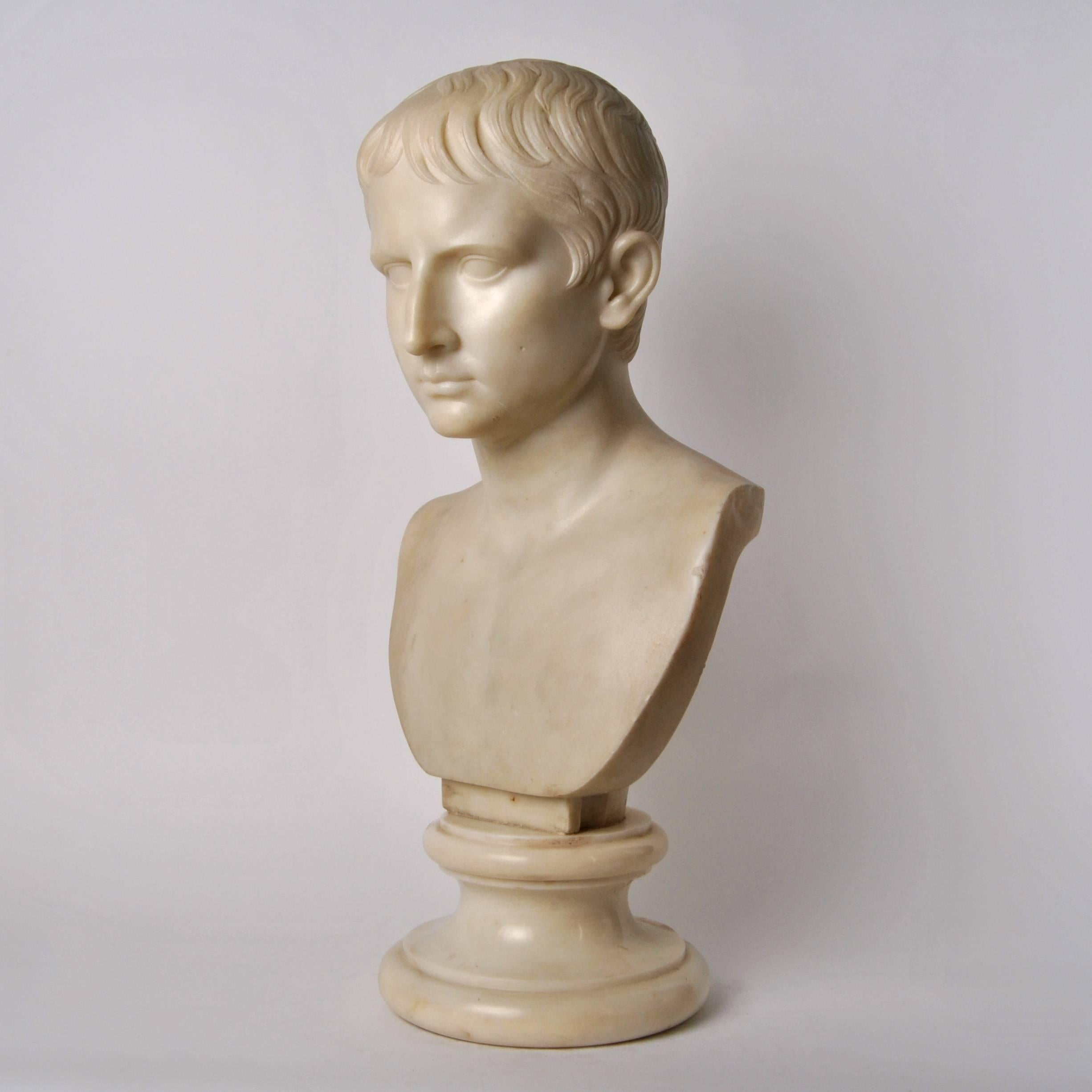 Bust made in white Carrara marble depicting the young Julius Caesar.