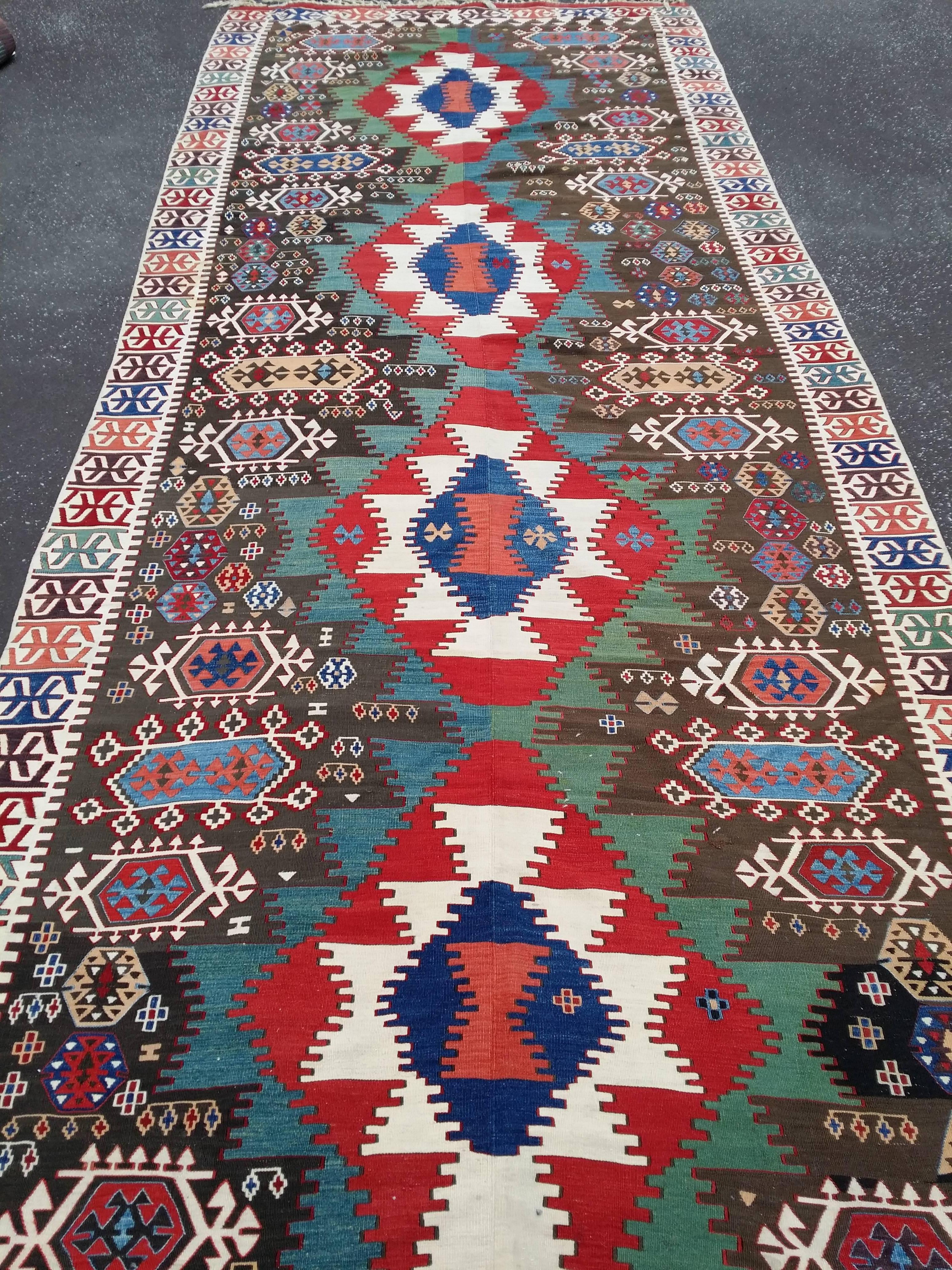 SE Anatolian kilim. Probably woven in the Adana -gaziantep area. Woven in two halves and them sewn together. Warps: ivory wool,Z2S plied. Patterning weft: wool,Z spun ( one green tone has Z2WS plied wool). Extra weft contours. Condition: very good,a