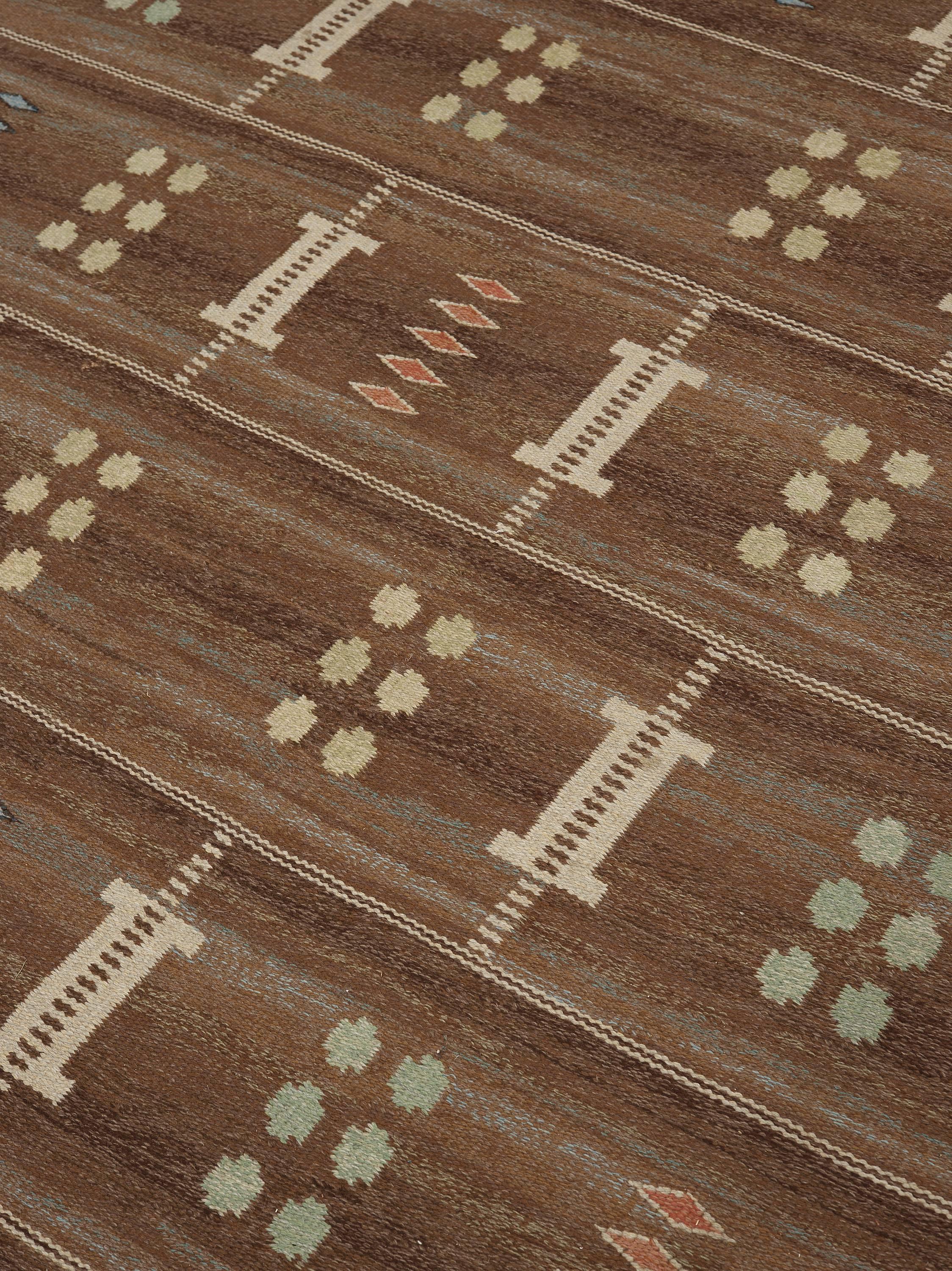 "Brun Fond" Swedish flatwoven, rölakan rug. Designed by Carl Dangel. Probably woven at Malmöhus - Läns Hemslöjd. Signed: CD. Design: brown melange ground with all-over pattern of geometric figures. Warp: light beige linen yarn. Patterning