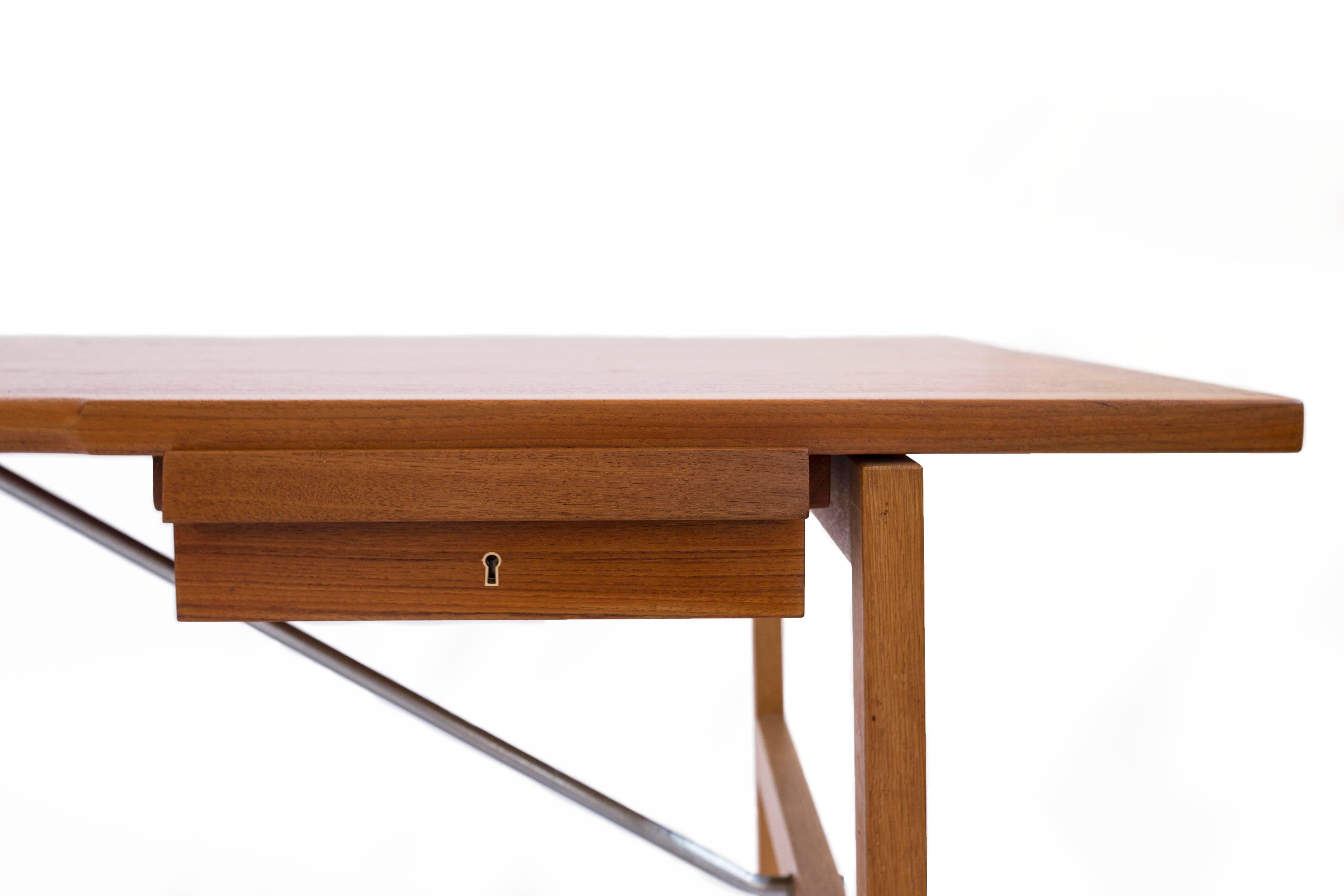 Large Hans J. Wegner freestanding worktable with oak frame, top and two drawers of teak supported by stretchers of chromed steel. 

Designed by Wegner 1964, manufactured and stamped by cabinetmaker Andreas Tuck, Denmark, model AT325A. 

Fine