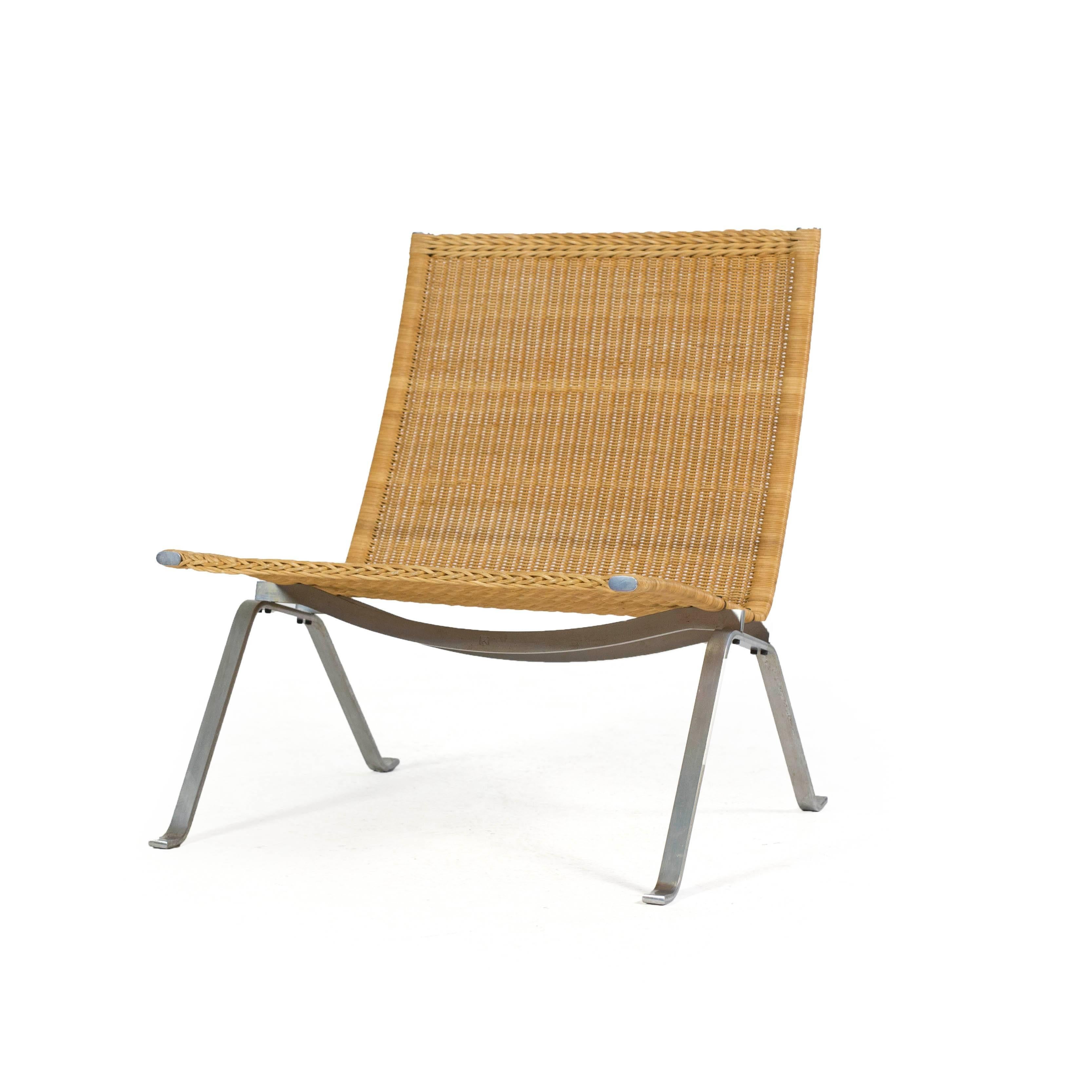 Poul Kjærholm PK22 with frame of steel, seat and back with original patinated wicker.

Designed by Poul Kjærholm in 1956, manufactured and stamped by E. Kold Christensen, Denmark. 

Excellent condition.