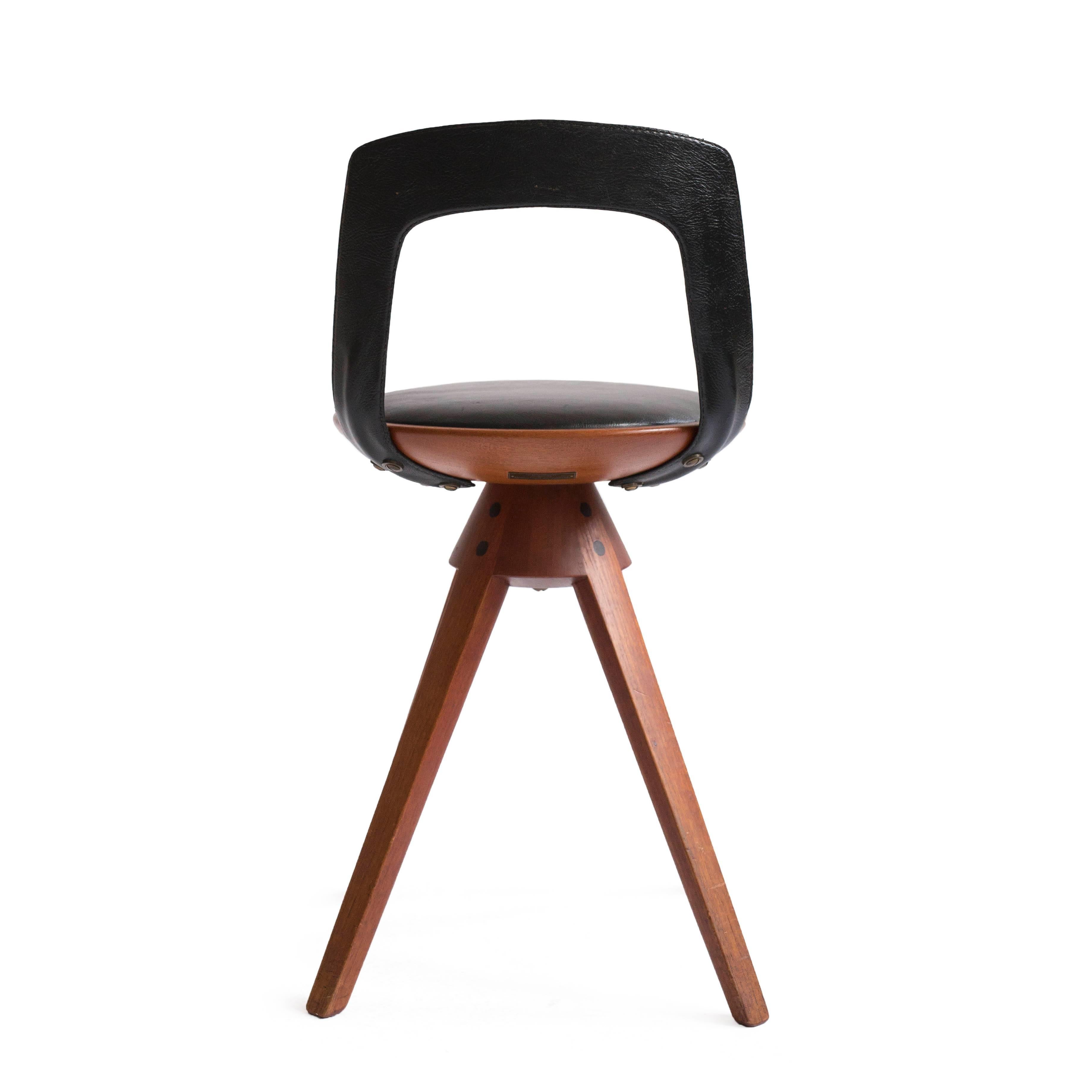 Tove & Edvard Kindt-Larsen swivel stool in teak and original black leather. 

Designed 1957, manufactured and marked by cabinetmaker Thorald Madsen, Copenhagen. Marked with metal plaque. 

Very fine condition.