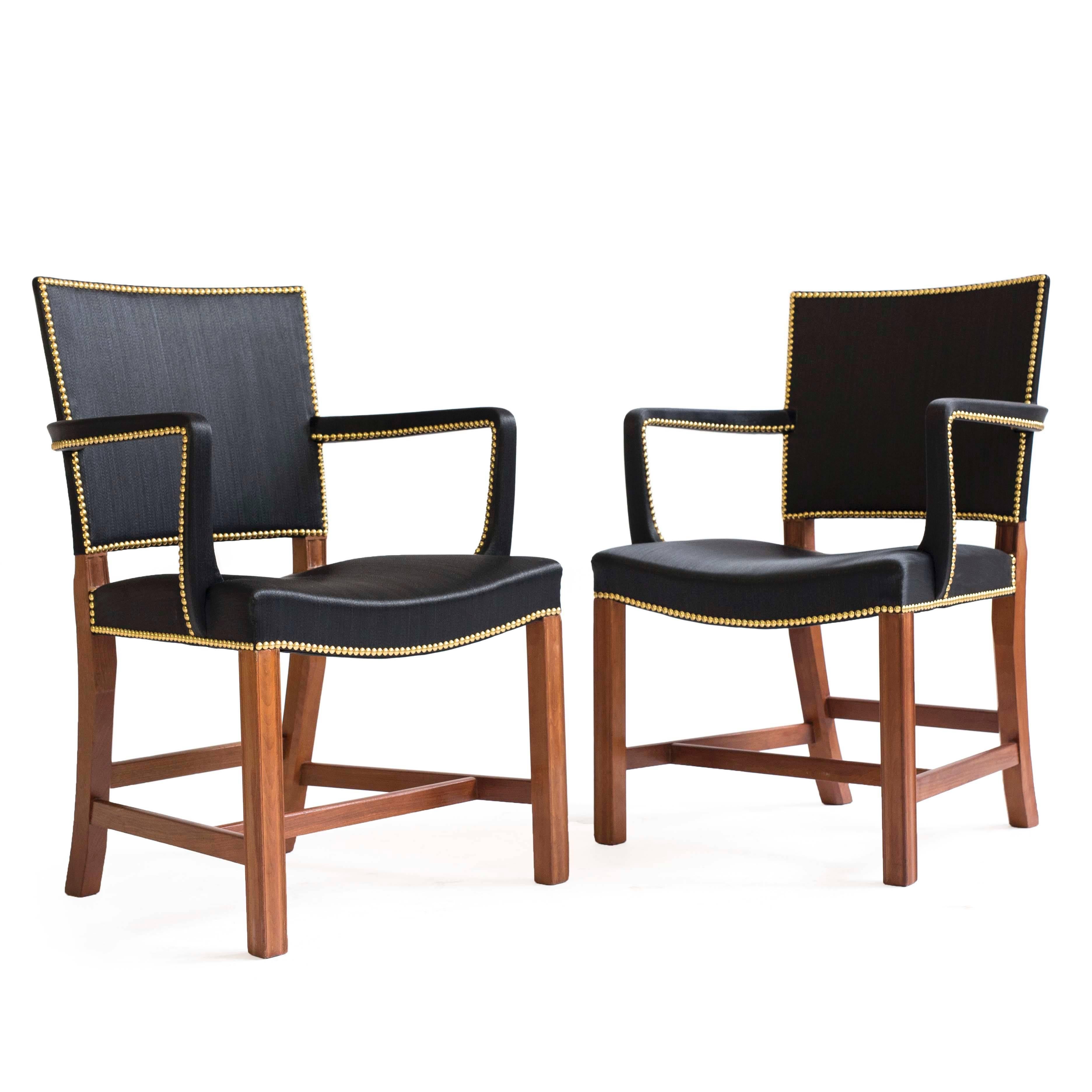 A pair of Kaare Klint 'Red armchairs' with profiled frames of Cuban mahogany, seat back and arms upholstered with black horsehair fitted with brass nails. 

Designed 1927, executed by cabinetmaker Rud. Rasmussen app. 1938-1940 model 3758A.