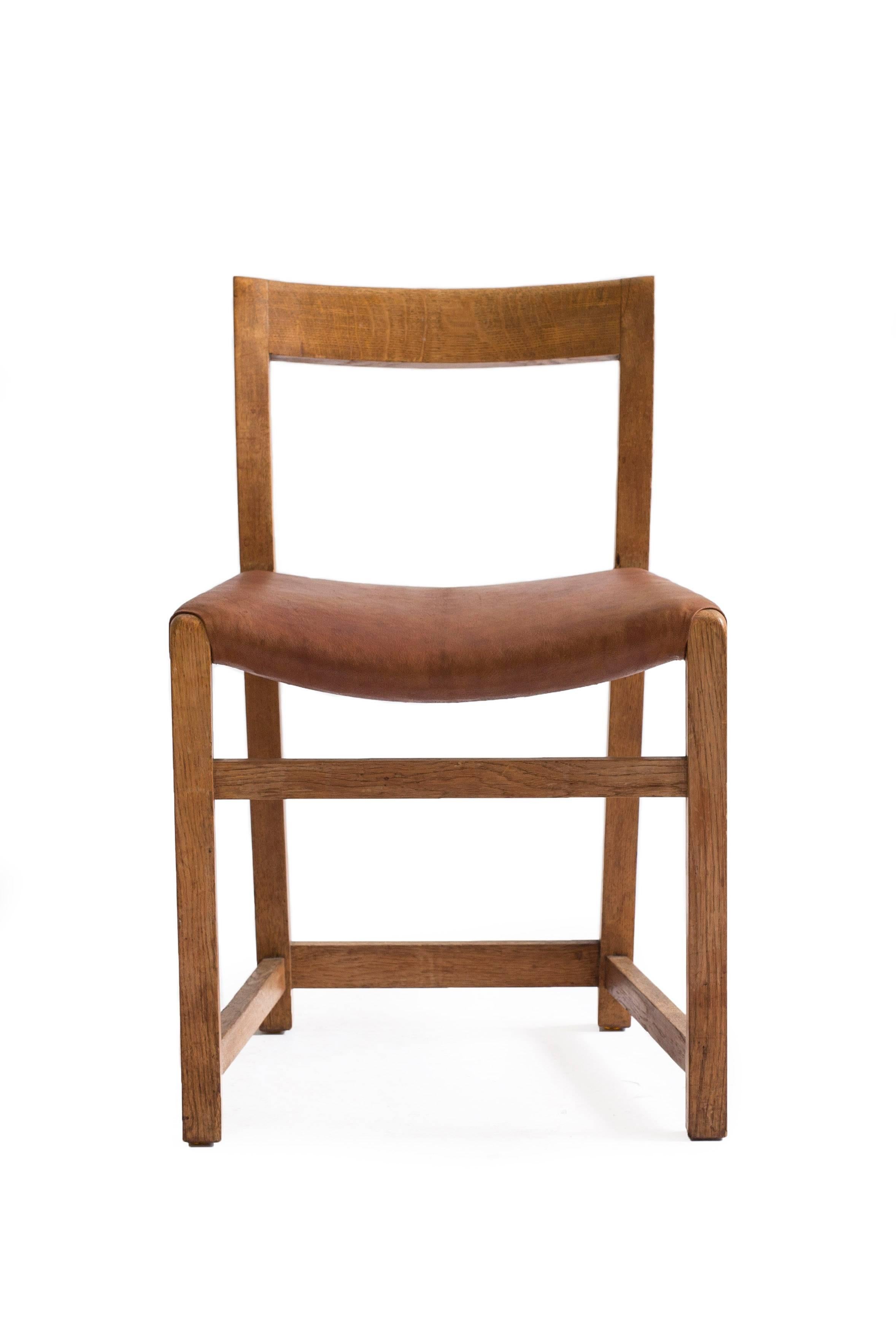 Rare Mogens Lassen side chair with frame of patinated oak, seat upholstered with Niger leather.

Designed 1934-1935 for the Eggert Møller villa, Gentofte, Denmark as part of "Le vrai total". Executed by cabinetmaker A. J. Iversen.

