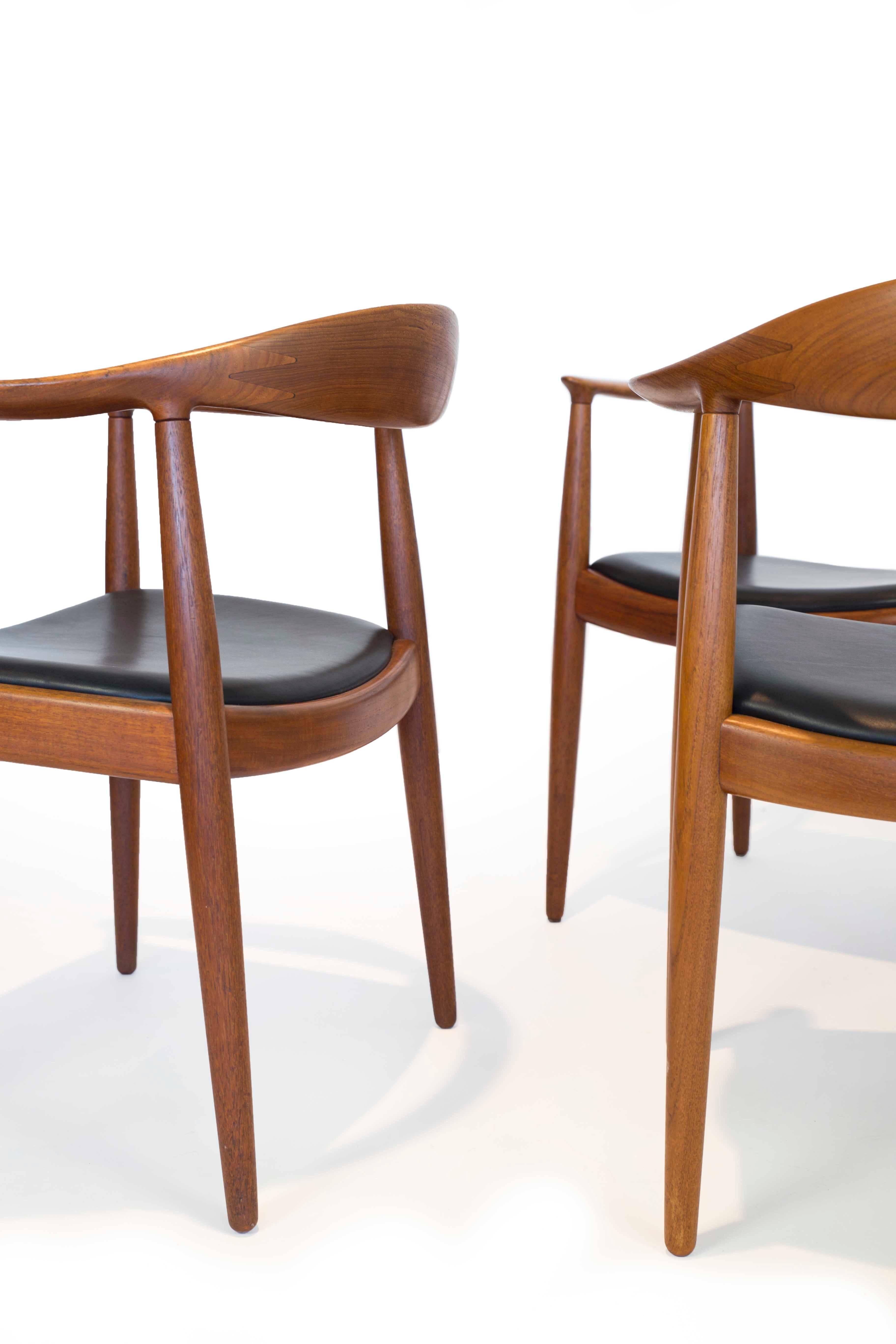 A set of six Hans J. Wegner 'The chair' with teak frame and black leather seats. 

Designed by Hans J. Wegner 1949, manufactured and marked by Cabm. Johannes Hansen, Denmark, model JH503. Beautiful condition.