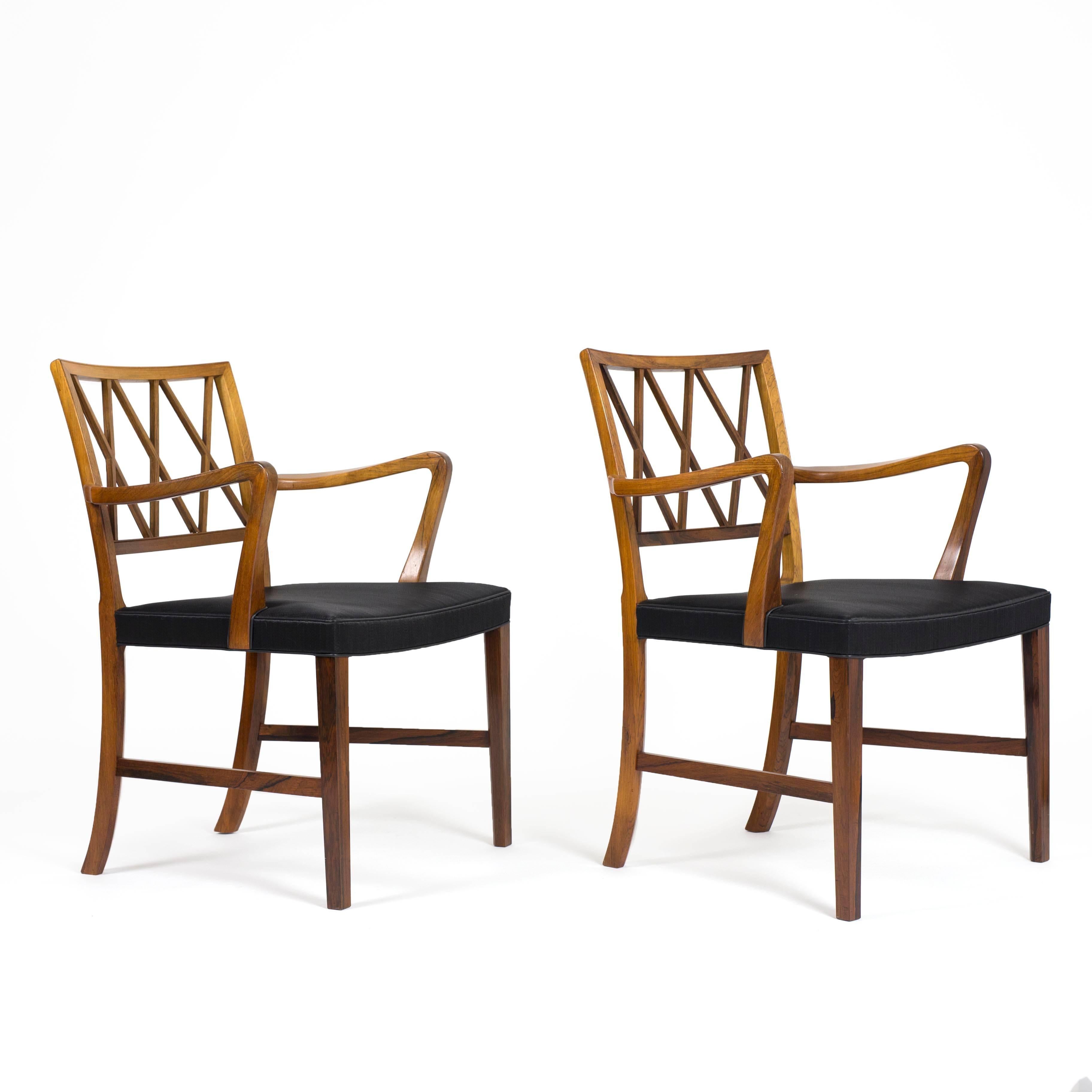 A pair of Ole Wanscher rosewood armchairs upholstered with black horsehair. 

Designed by Ole Wancher 1942, executed by A. J. Iversen, Denmark. 

Very fine condition.