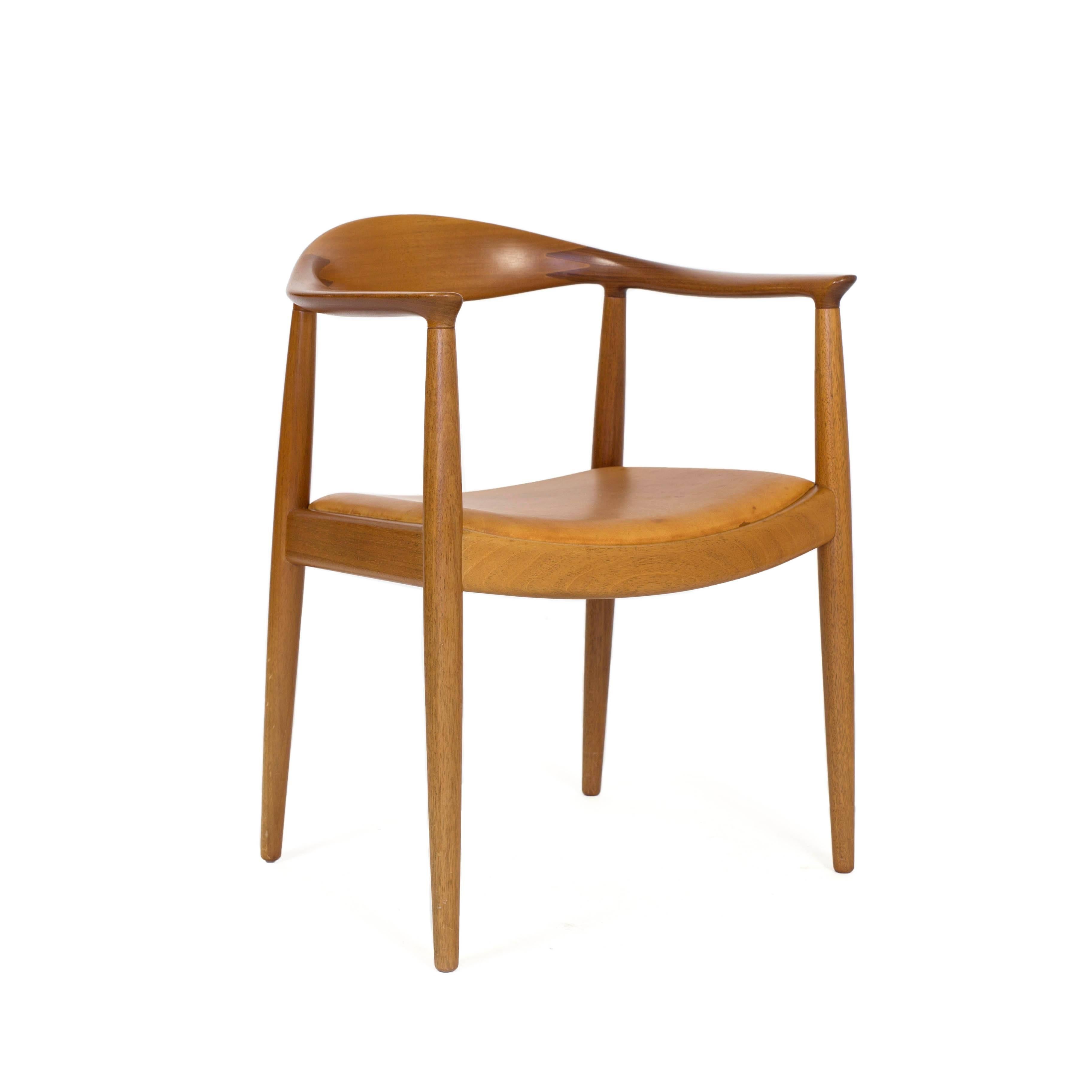 Hans J. Wegner 'The chair' with mahogany frame and seat upholstered with natural leather. 

Designed by Hans J. Wegner 1949, manufactured and marked by Cabm. Johannes Hansen, Denmark, model JH503.