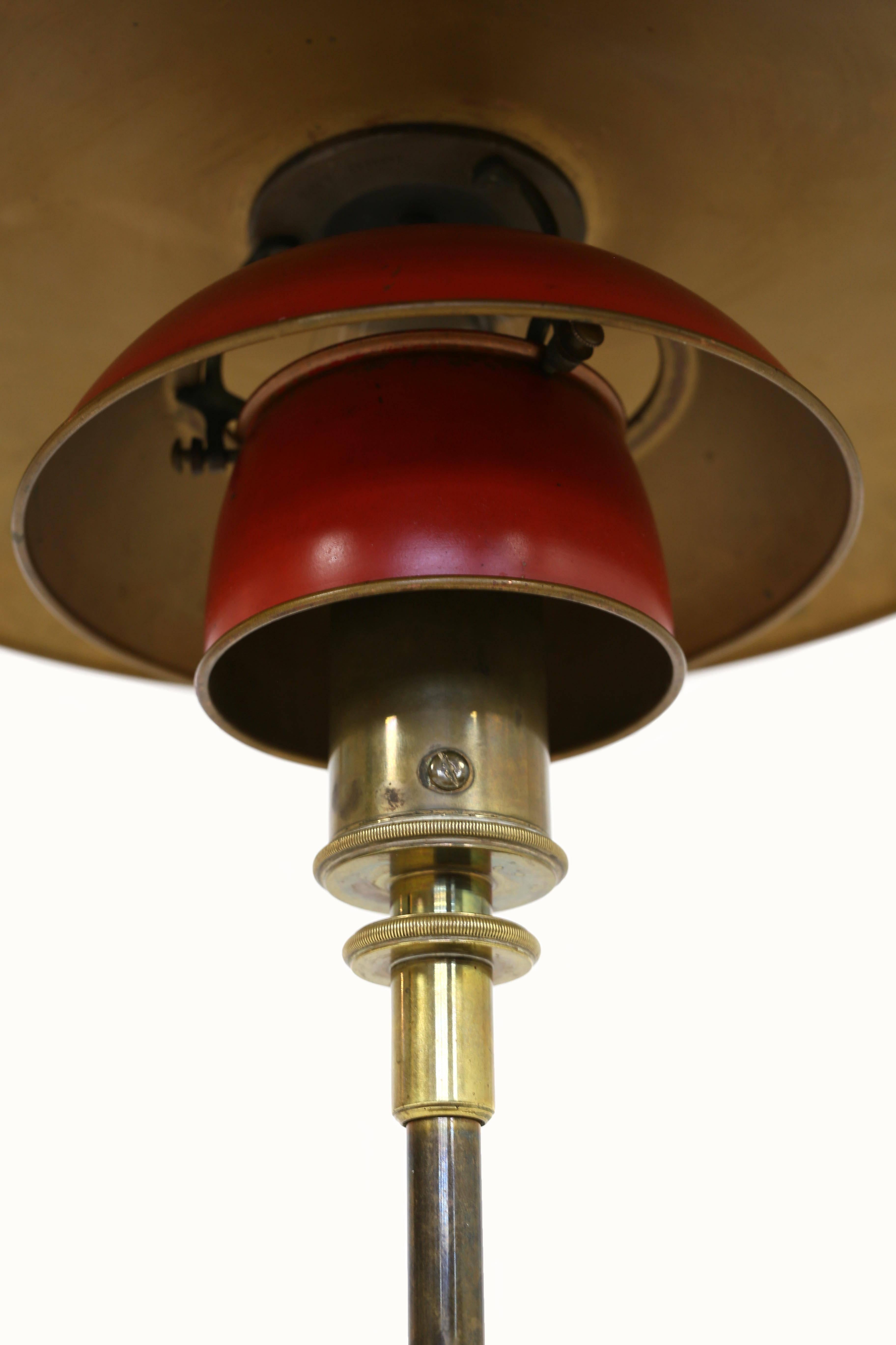 Early and rare Poul Henningsen 4/3 table lamp. Designed 1927 and made at Louis Poulsen, Denmark, 1927-1928.

Brass and original red and bronze copper shades.

Marked 'Pat. Appl.'.