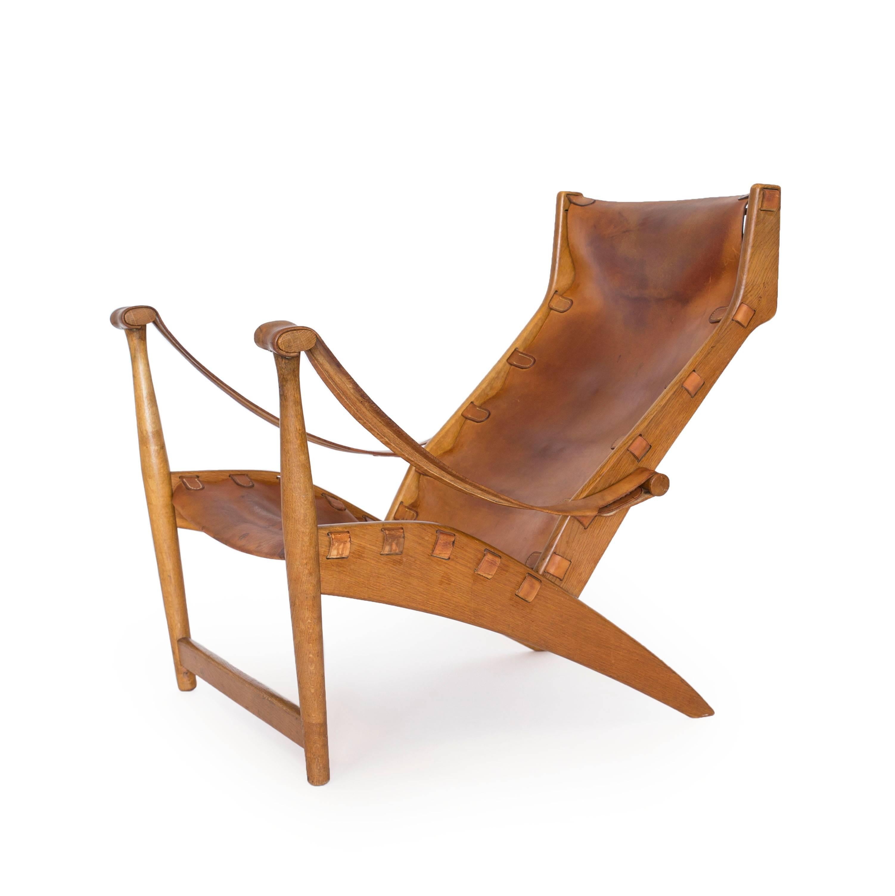 Early Mogens Voltelen 'Copenhagen chair' with frame of patinated oak, seat and back upholstered with original natural leather. 

Designed in 1936, executed by cabinetmaker Niels Vodder, Denmark. 

      