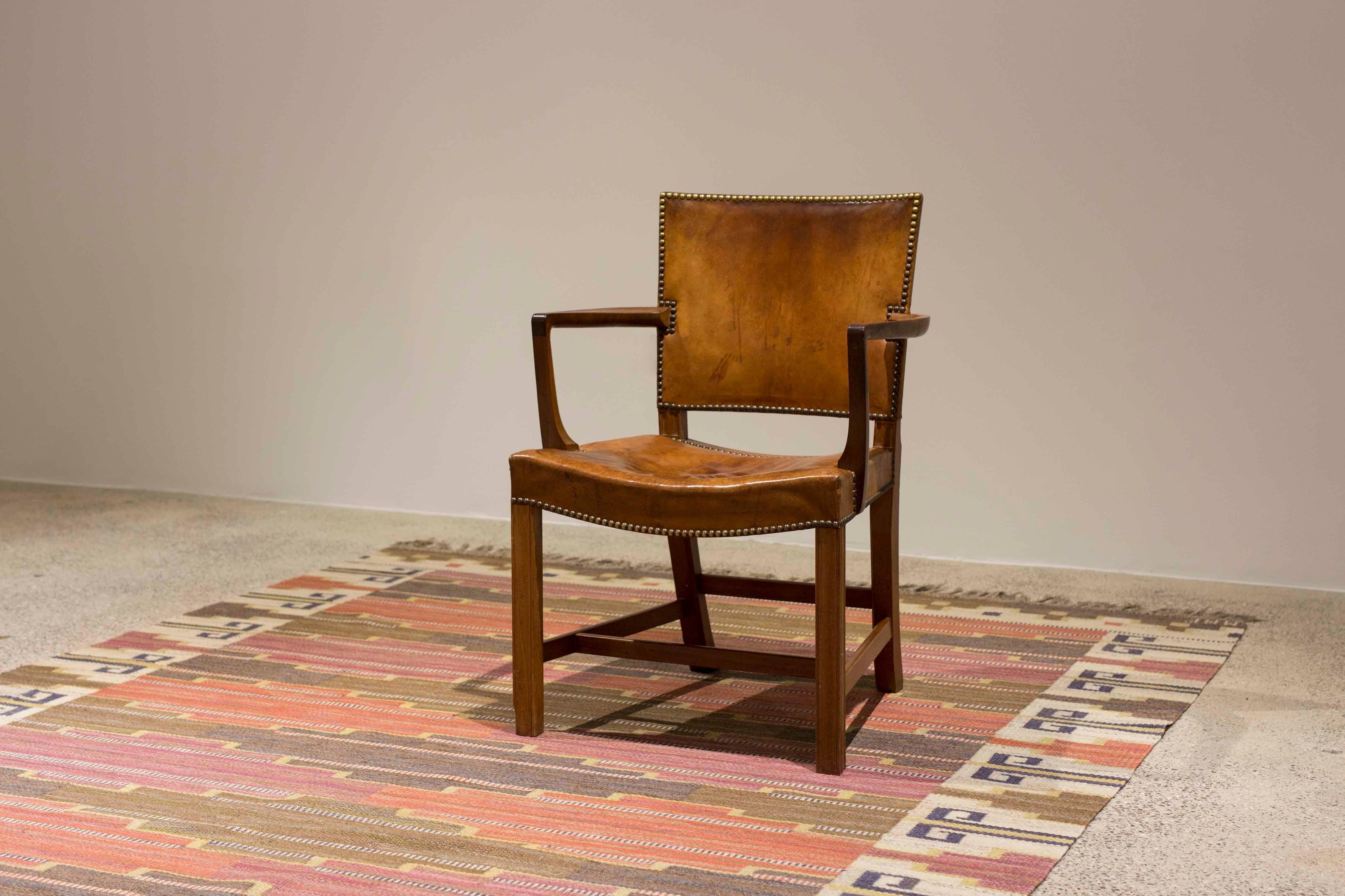 Early Kaare Klint 'Red chair' with frame of Cuban mahogany and original patinated Nigerian leather. 
Designed 1930 and executed at Rud. Rasmussen, Denmark, 1930s. 
Natural patina to wooden frame and leather. 

Additional photos and condition