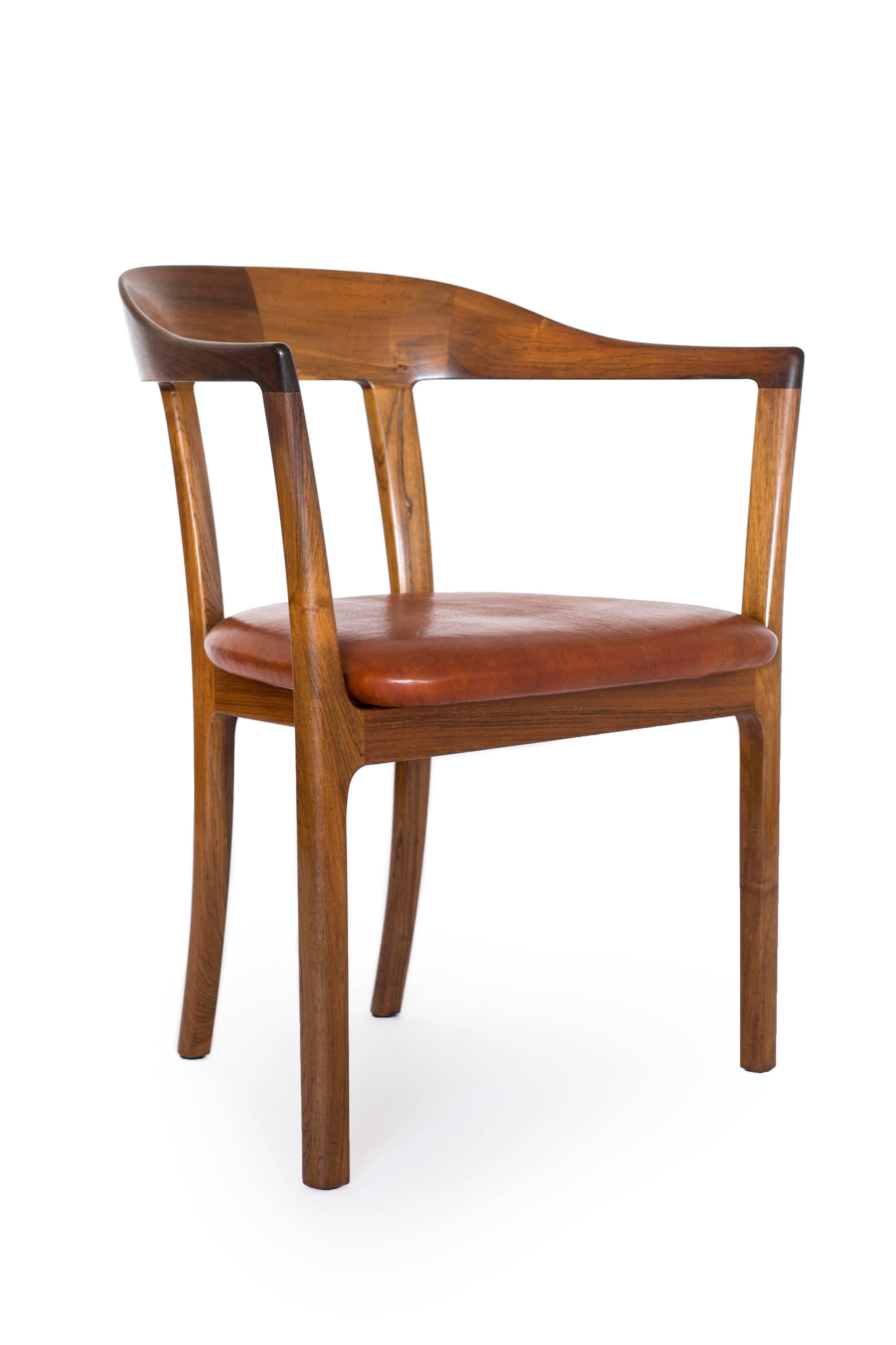A set of four Ole Wanscher armchairs of Brazilian rosewood, seats upholstered with Nigerian leather. 

Designed 1958 and executed by cabinetmaker A. J. Iversen, Denmark. Model J2833.

Beautiful condition. Priced individually.