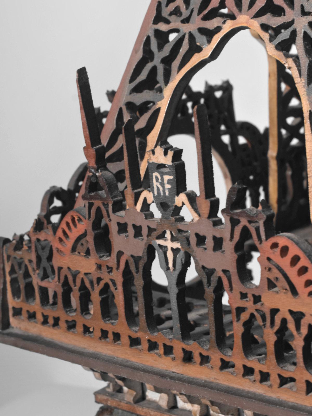 An astonishing and spectacular large-scale model of the Eiffel Tower, made entirely of cut polychrome wood. 

This work of patient, virtuoso craftsmanship is distinguished by the finesse of its openwork decorations, its architectural elegance and