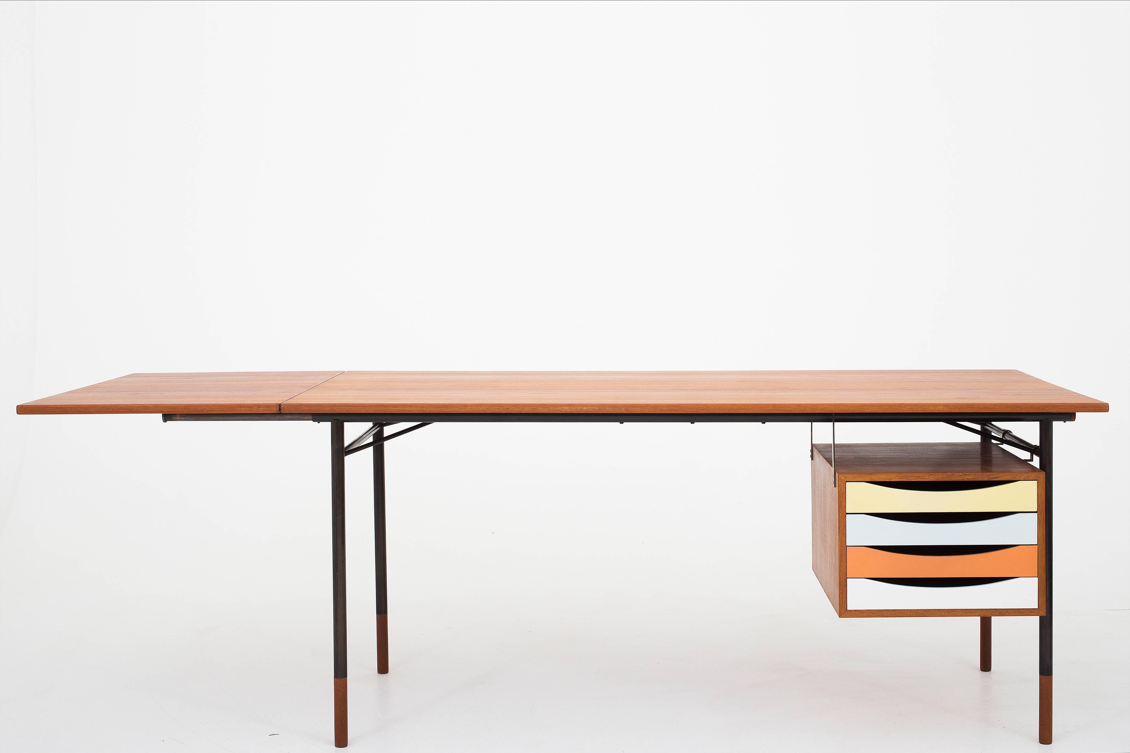 Finn Juhl BO 69 Nyhavn desk, base in steel, tabletop and shoes in teak. Maker Bovirke.