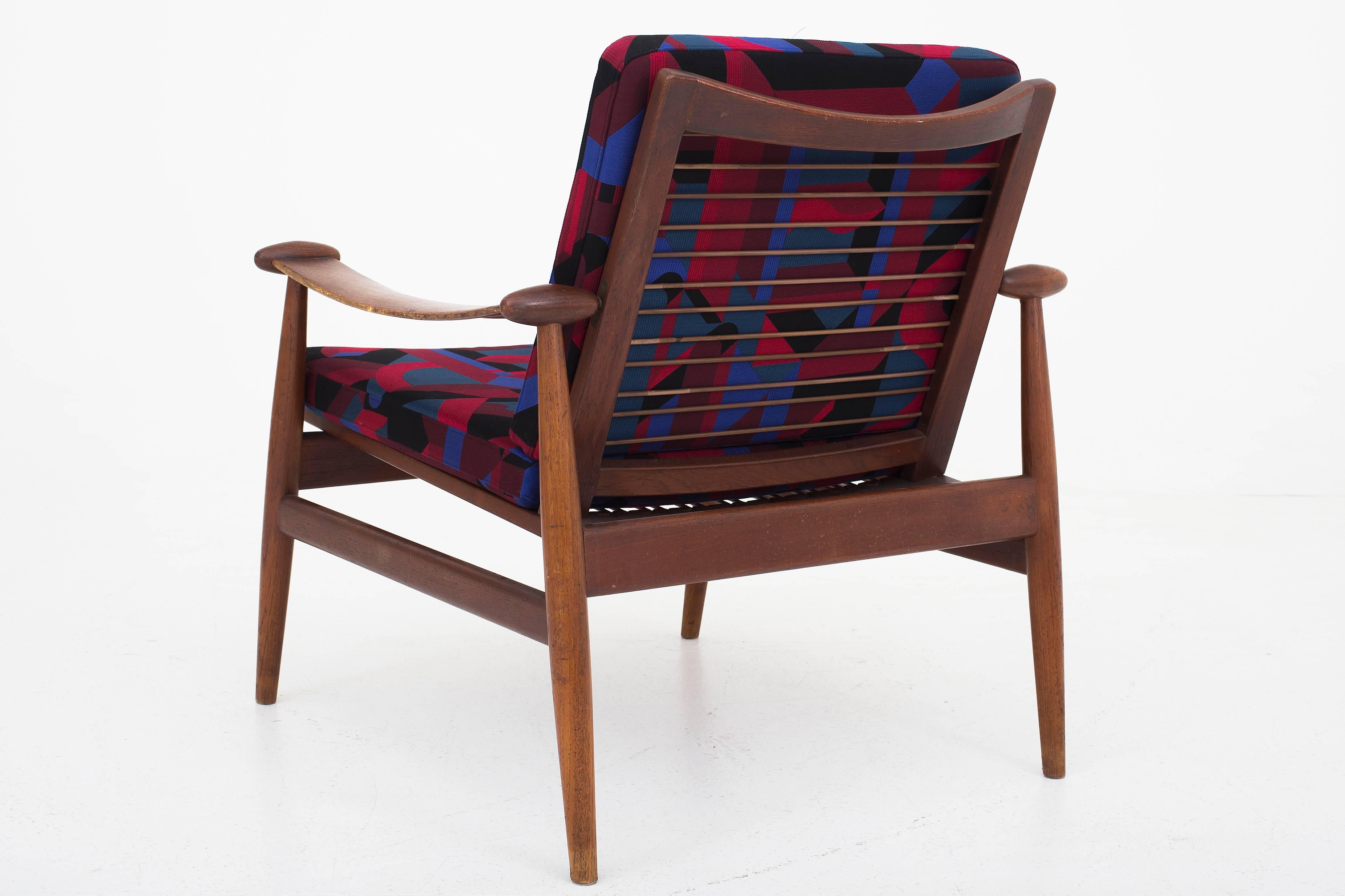 A pair of chairs in teak by Finn Juhl, model FD133 with new upholstry in perspective Cavaliere Atlantique MO3 from Hermes, Paris. Maker France & Son.