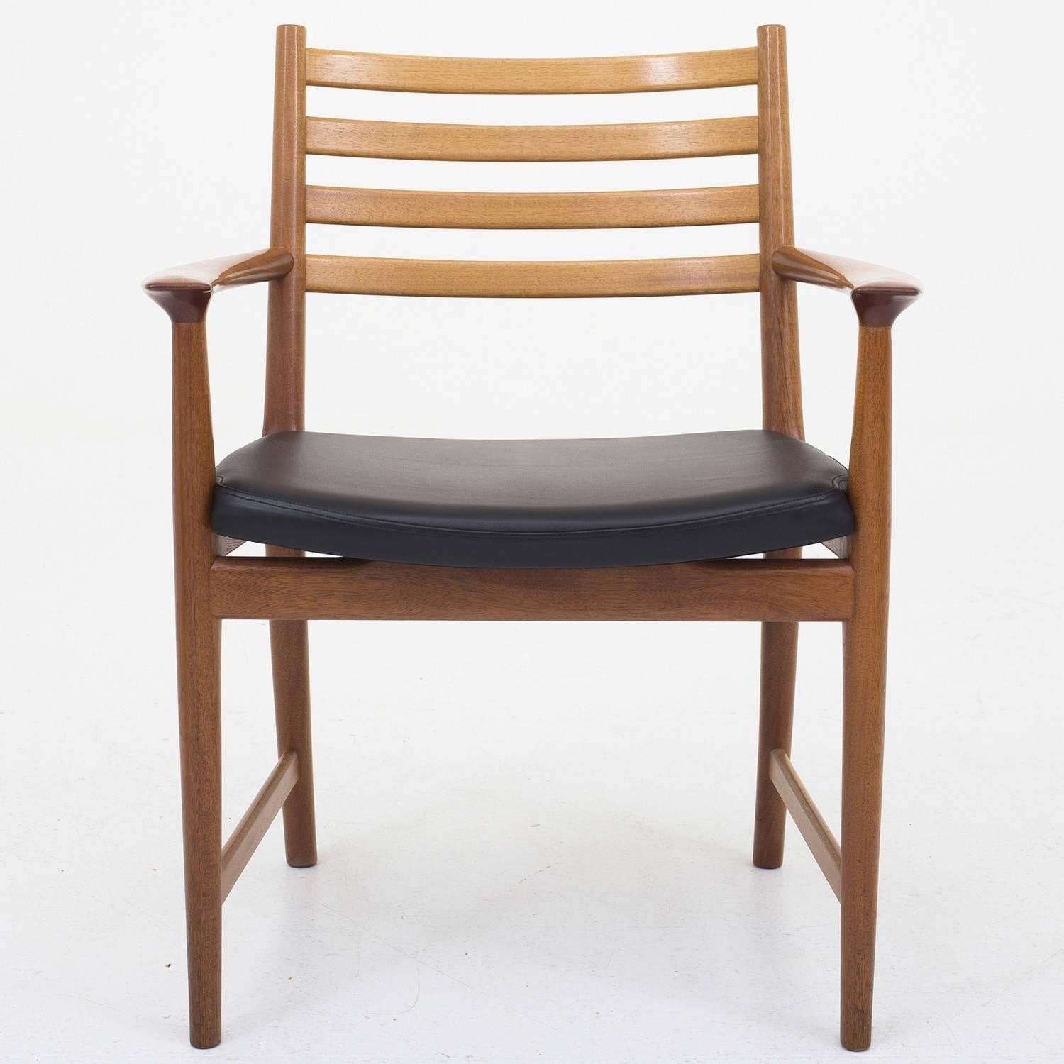 Set of six armchairs in mahogany and black leather, model 504. Designed by Kai Lyngfeldt Larsen. Maker Søborg Møbelfabrik.