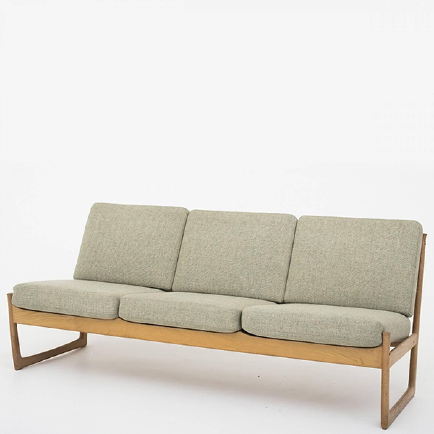 Sofa in oak and cushions in wool. Designed by Peter Hvidt & Orla Mølgaard Nielsen. Maker, France and Son.