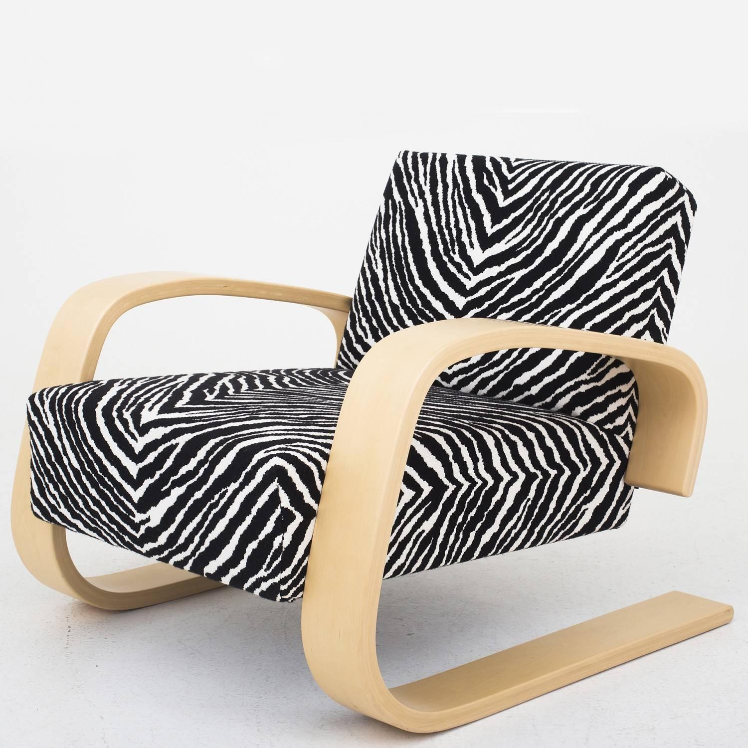 A pair of Tank chairs, model 400 in beech and fabric. Designed by Alvar Alto and produced by Artek.