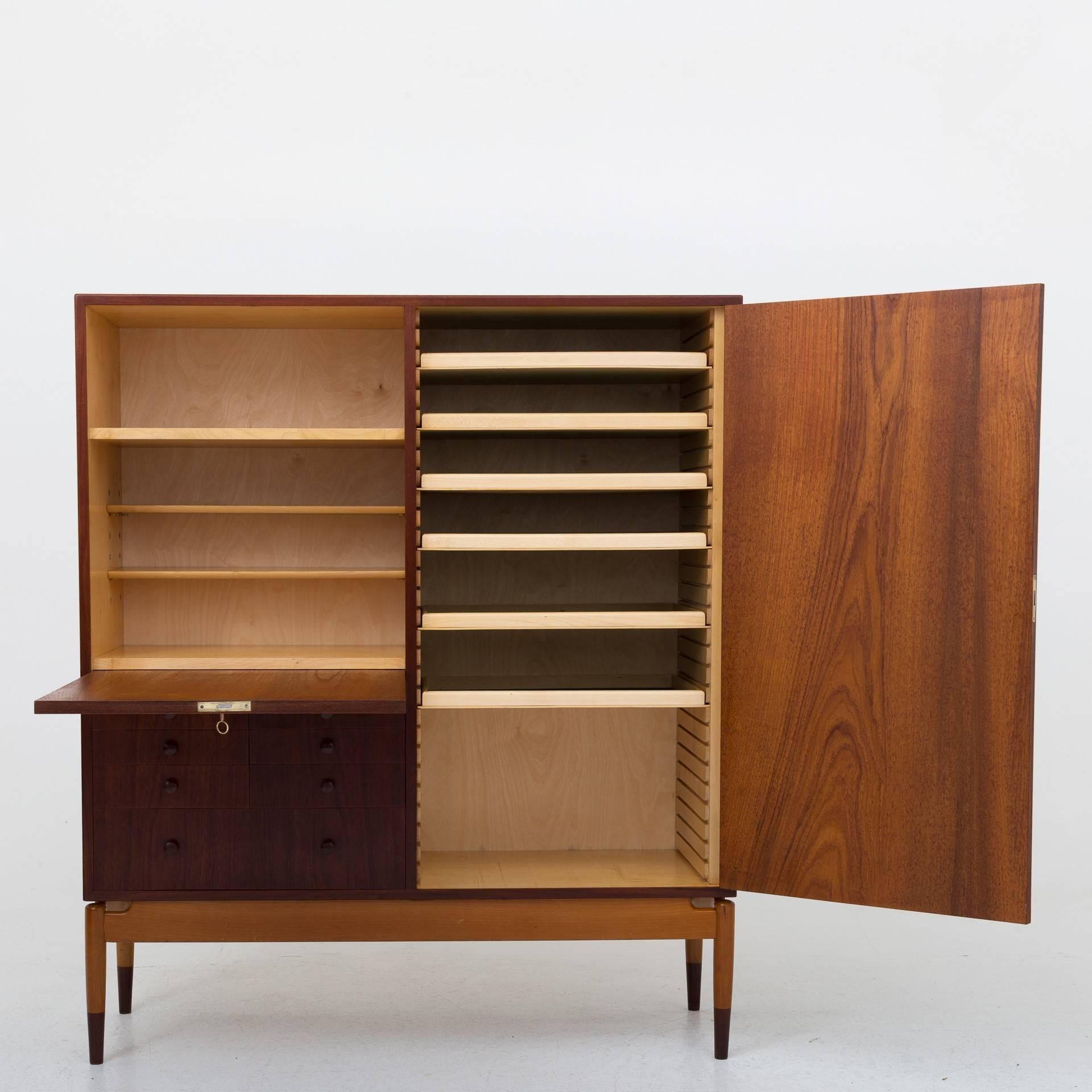 Cabinet in teak, base/legs in beech, front with eight drawers. Designed by Finn Juhl and produced by Søren Willadsen, Vejen.