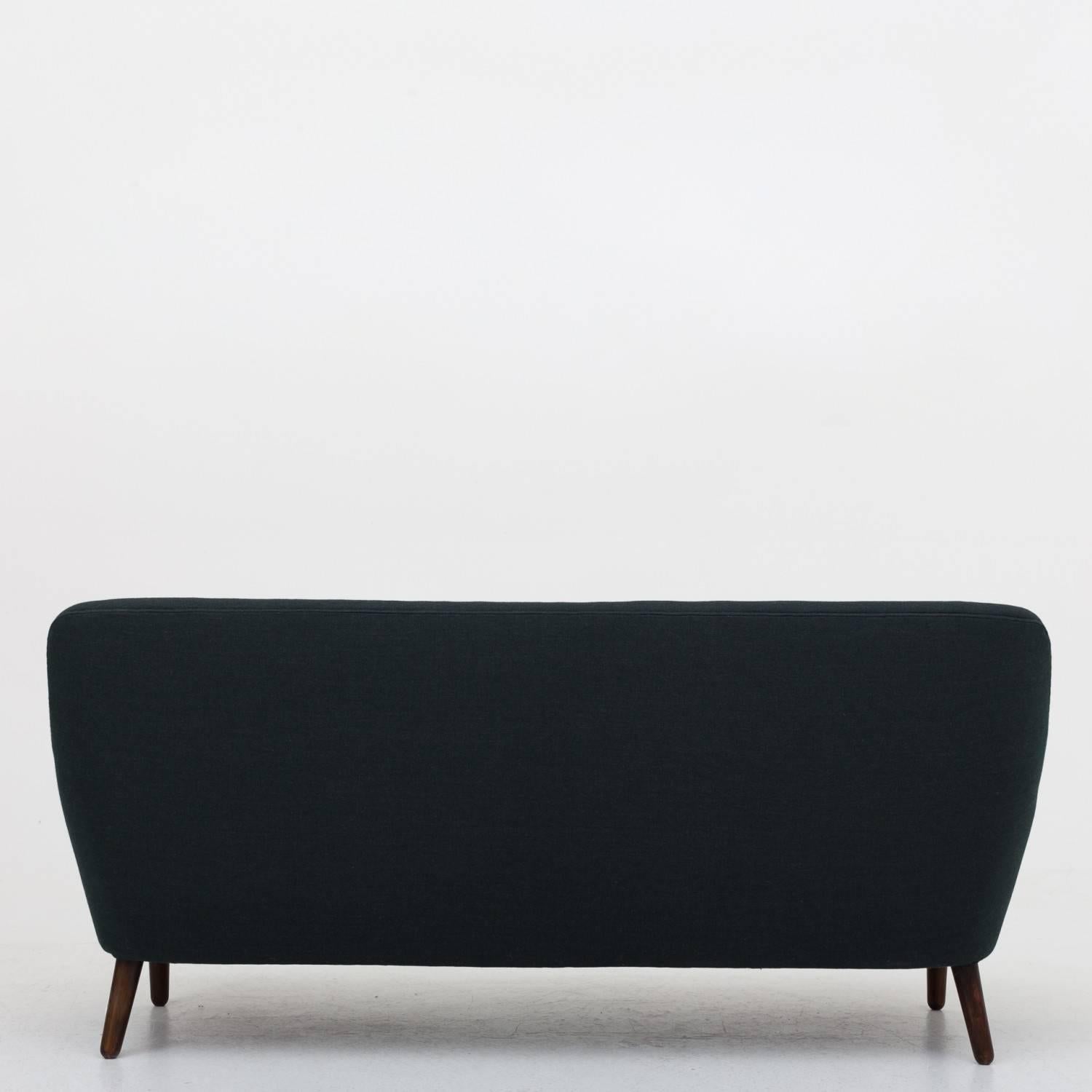 Three-seat sofa reupholstered in wool, Fjord 911 and legs in oak. Maker unknown Danish cabinetmaker.
