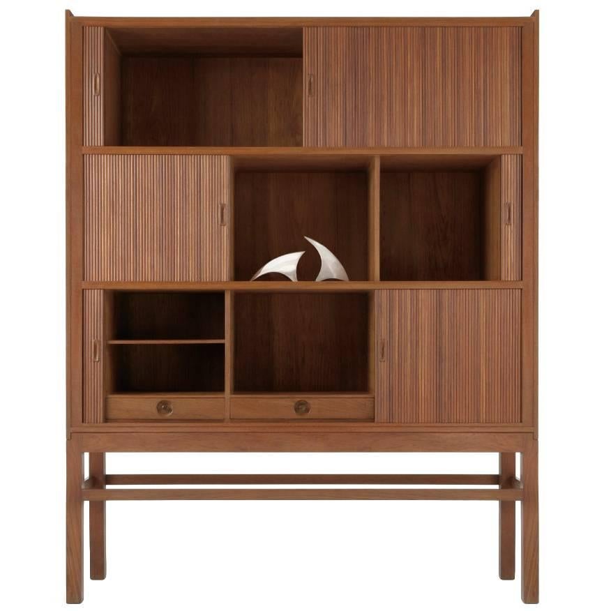 This unique cabinet made of solid teak by the designer himself, was part of his final graduation where he achieved a silver medal for his work in 1954. The cabinet was later exhibited at the most important design fairs together with Finn Juhl, Børge