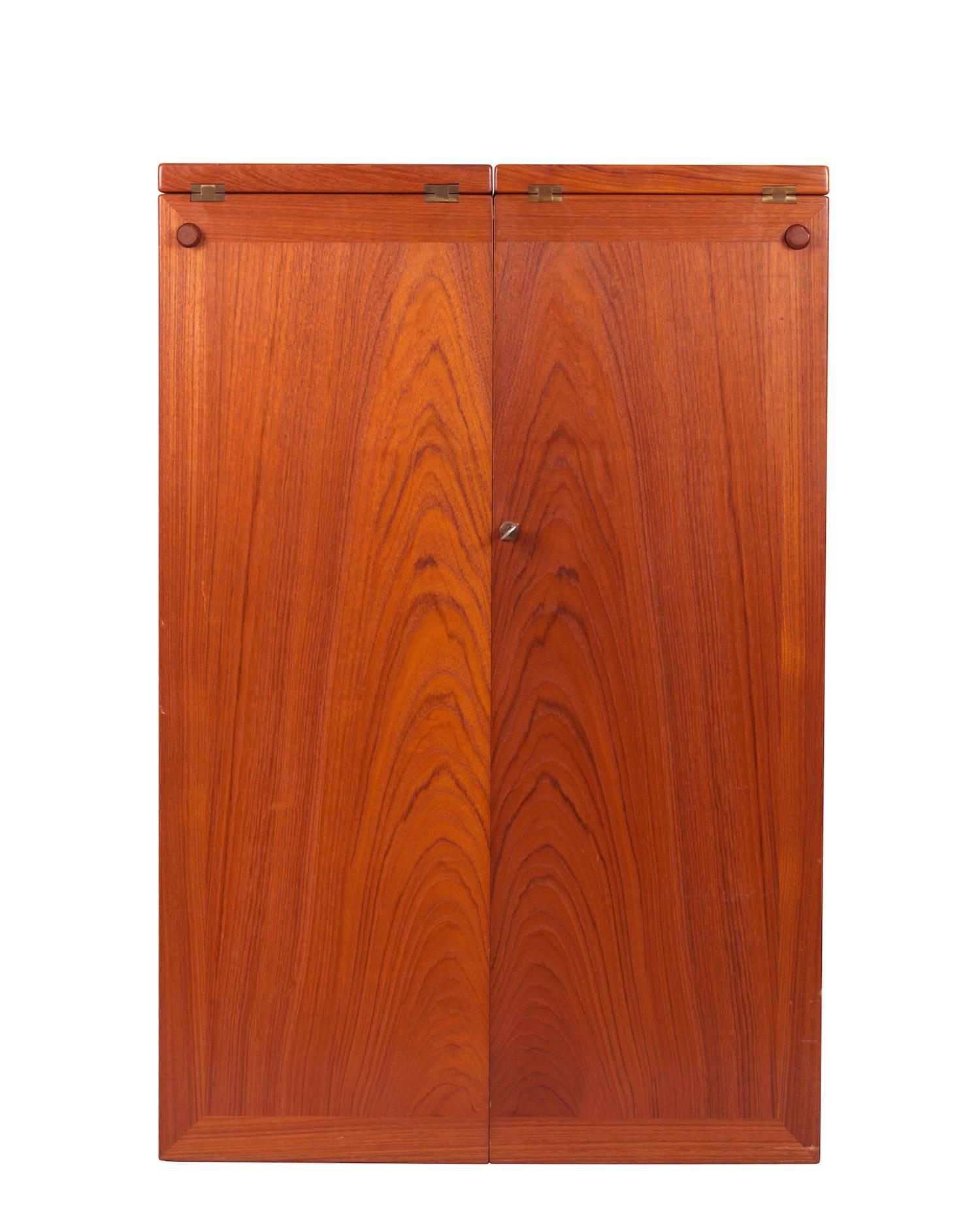 Teak bar on wheels with brass fittings and table top with folders