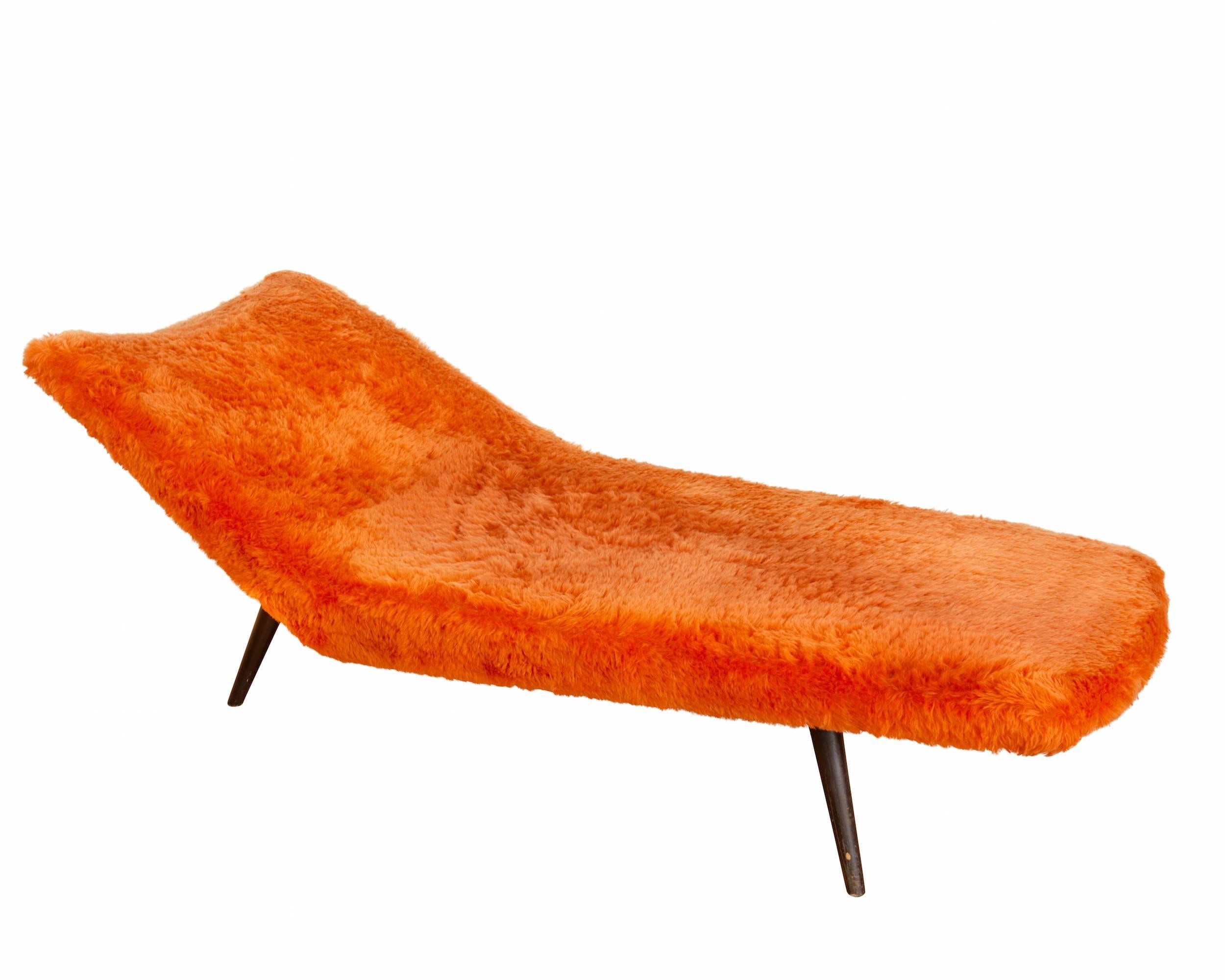 Daybed with orange long hair upholstery and frame of browned oak. 
Manufactured by Eugen Smith Soloform in the 1950s.
