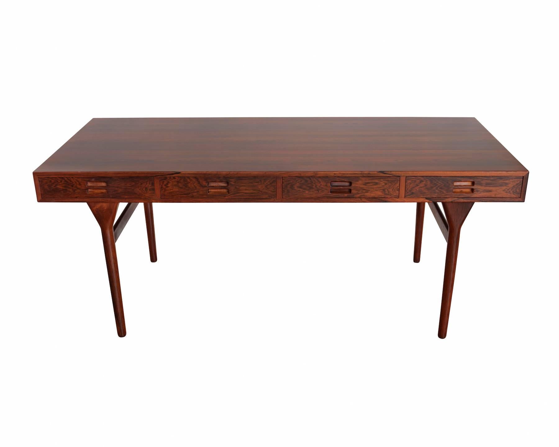 Rosewood desk with four drawers, designed in 1958. 
Manufactured by Søren Villadsen.
