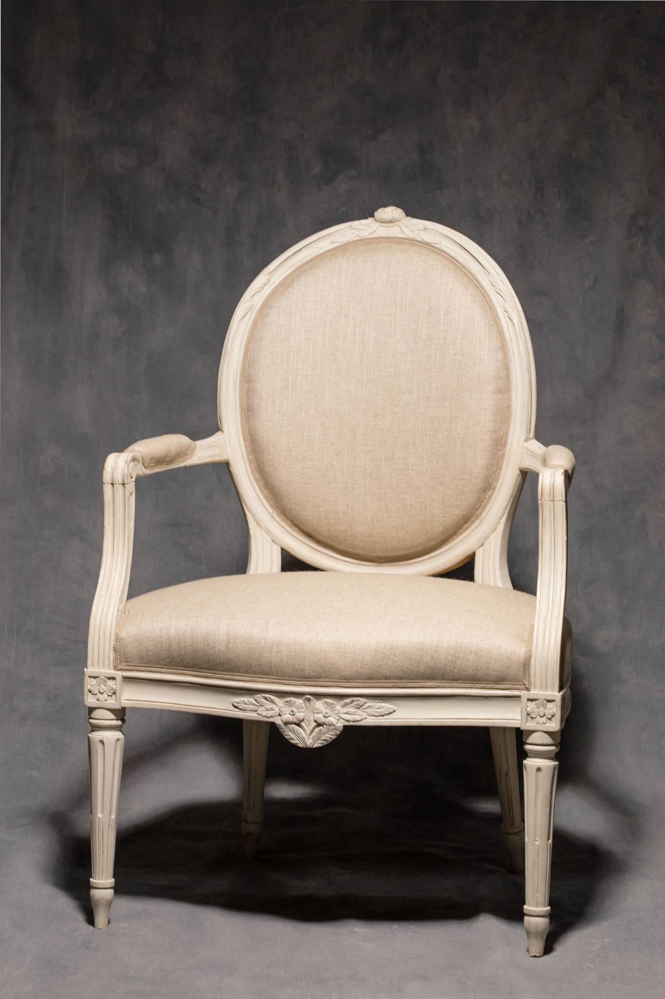 A fine pair of painted Gustavian armchairs signed and hallmarked Johan Hammarström, Stockholm, circa 1780.