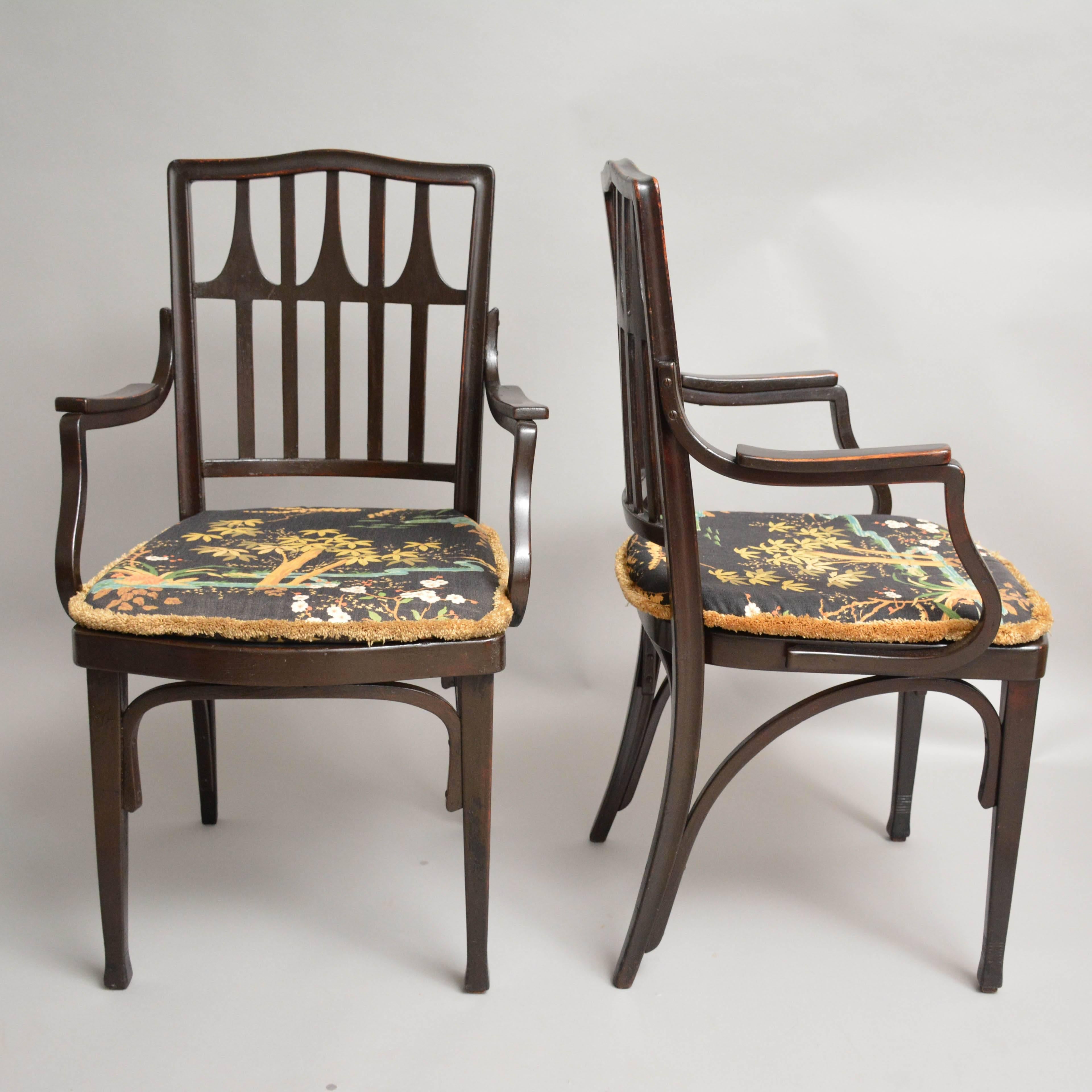 A pair of armchairs designed by Gustav Siegel. Manufactured by Jacob & Josef Kohn, Austria, 1905-1910. The seat cushion upholstered in Japanese pattern. The chairs is made of acajou stained wood.