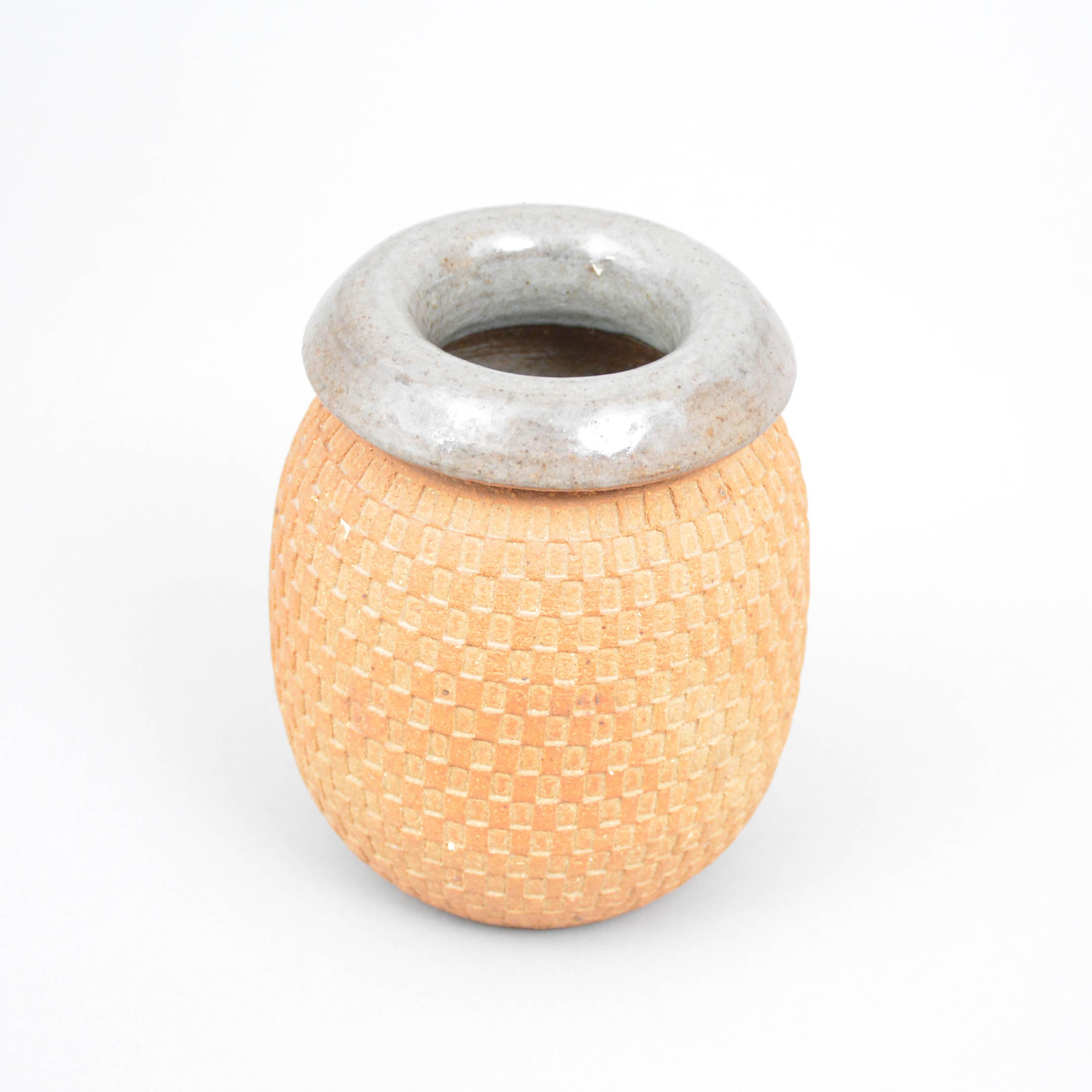 A rare and unique stoneware vase by Stig Lindberg for Gustavsberg, Sweden. Signed and dated 1962. The inside glazed in celadon to light grey glaze. The outside unglazed.