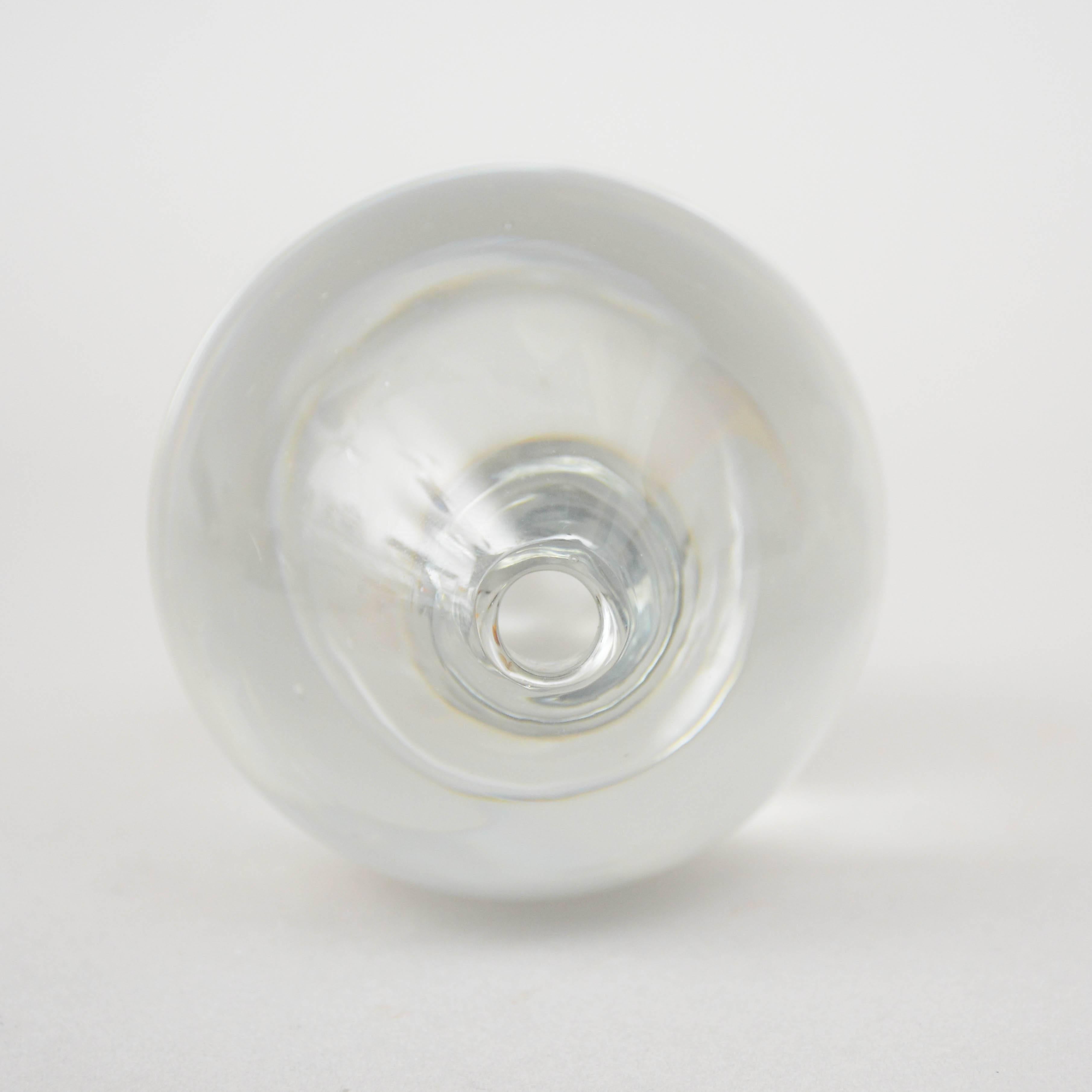 A ovoid shaped vase of clear crystal by Tapio Wirkkala for Iittala, Finland. Signed and dated 1955.