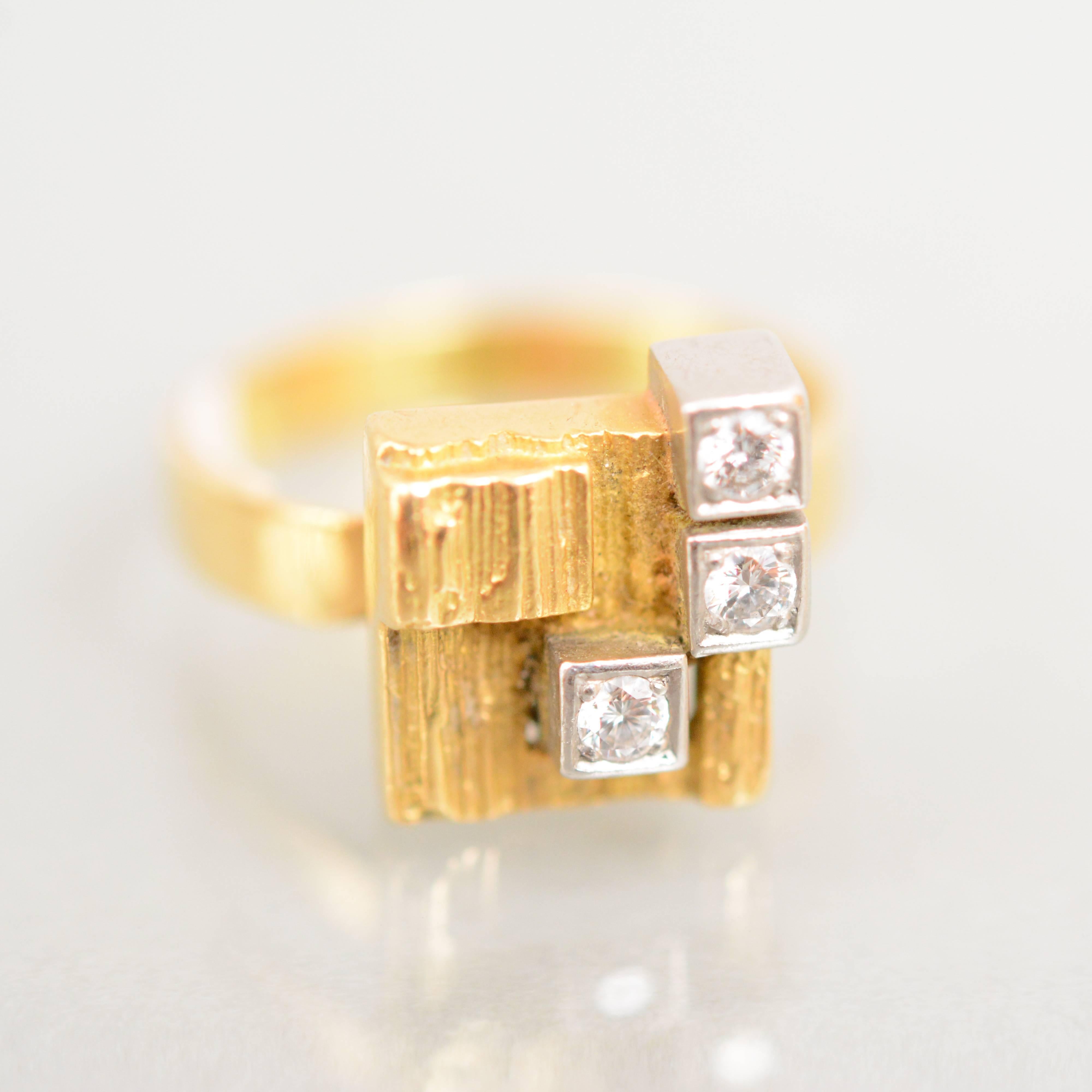 A rare gold and diamond ring, Diamond City, by Bjorn Weckstrom for Lapponia, Finland. Designed in 1969. This ring is dated K8 for 1987.

Size: 17 1/4 mm.