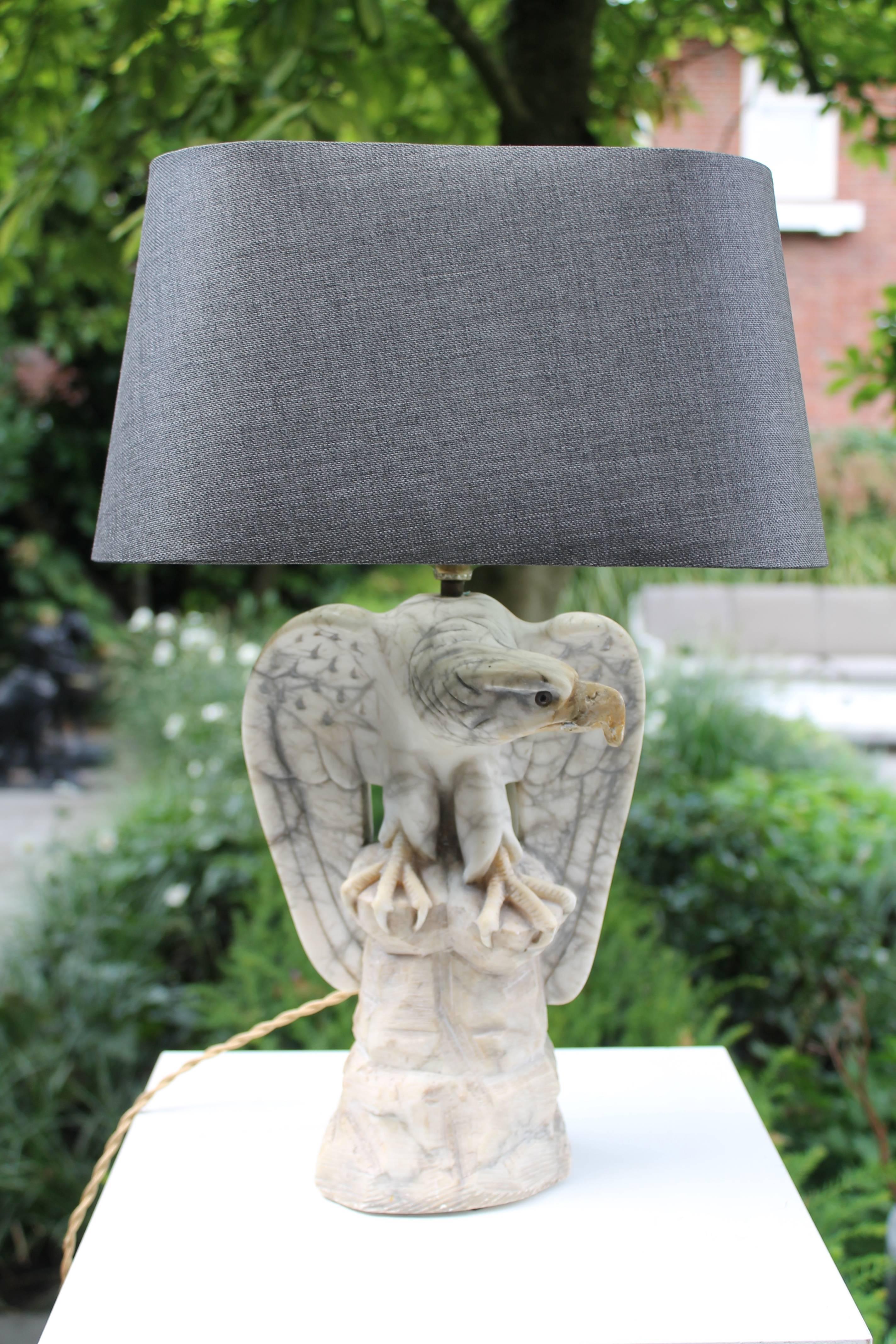 Pair of marble eagles as table lamps, with new fittings, wires and plugs.